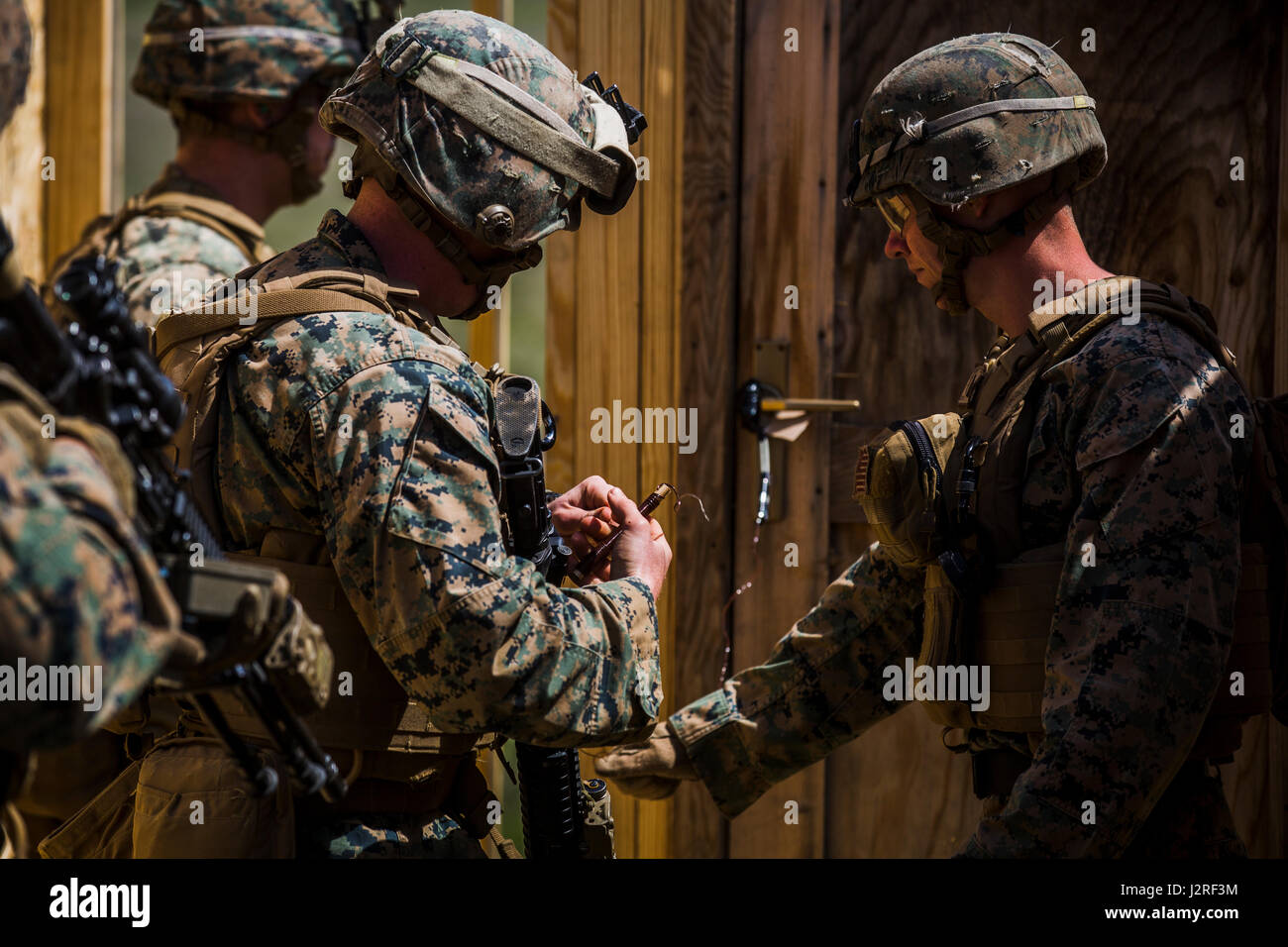 U.S. Marines with Black Sea Rotational Force 17.1 prepare to detonate a donut charge during Exercise Platinum Eagle 17.2 at Babadag Training Area, Romania, April 26, 2017. Marines conducted a demolition range to maintain skills and to improve proficiency with various charges. BSRF’s participation in Platinum Eagle allows training with multiple partner nations and is crucial in dealing with regional issues and keeping peace in the Eastern European region. (U.S. Marine Corps photo by Lance Cpl. Sarah N. Petrock) Stock Photo