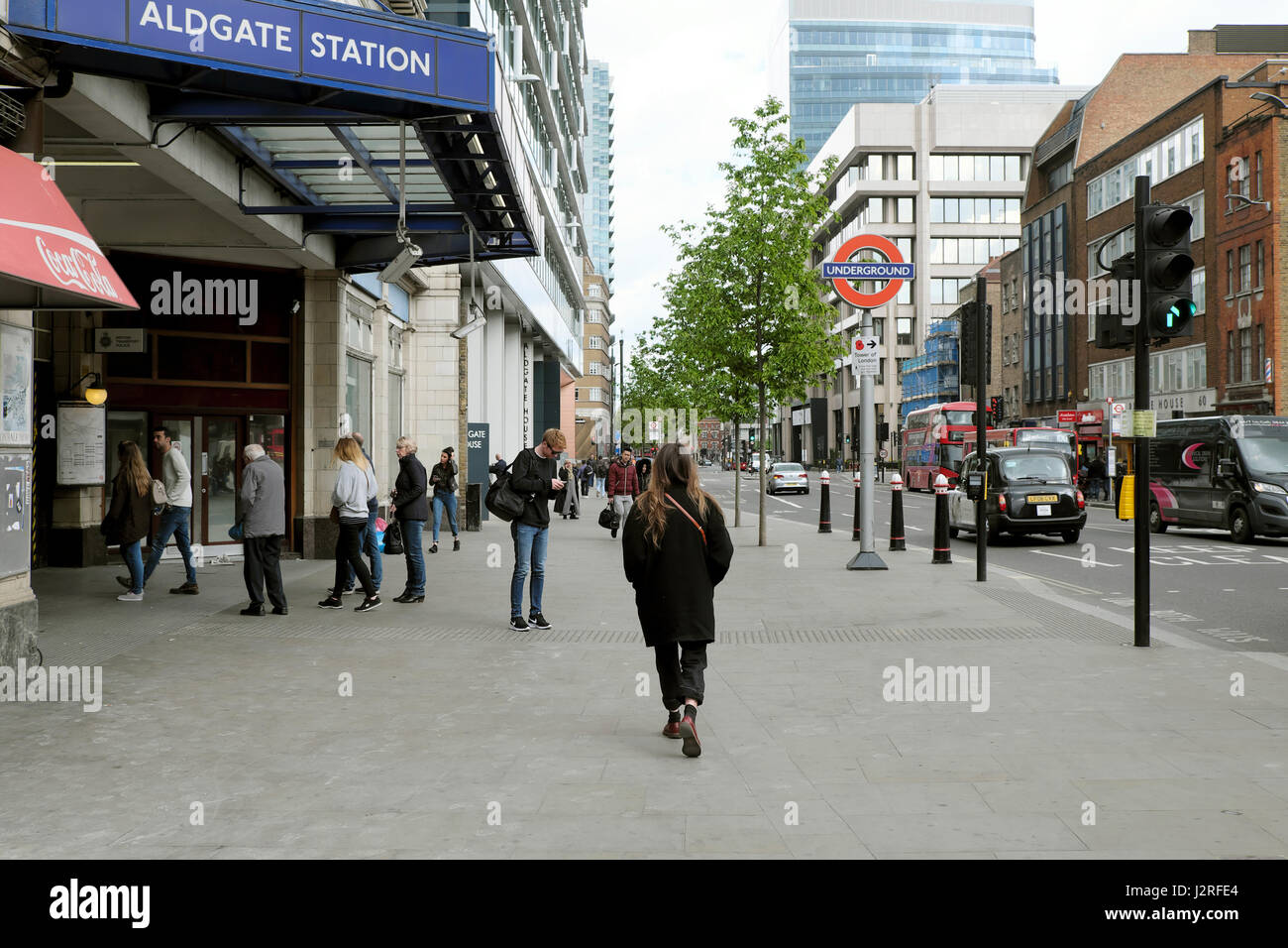 View of people walking outside Aldgate Tube Station on Aldgate High Street  in East London UK  KATHY DEWITT Stock Photo