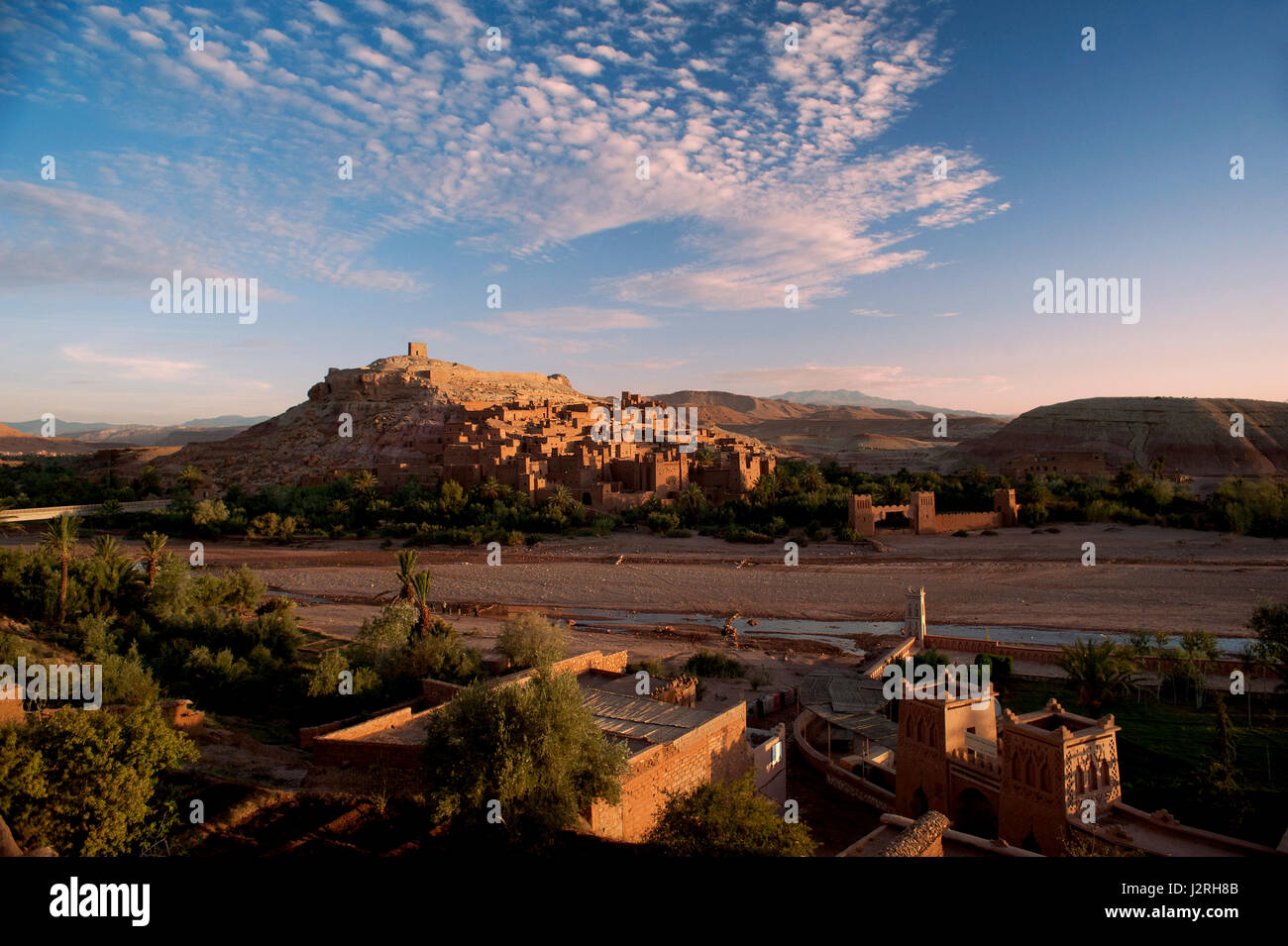 The fortified town or ksar of Ait Benhaddou lit up at sunrise in Morocco's arid Atlas Mountains. it is a UNESCO World Heritage Site. Stock Photo