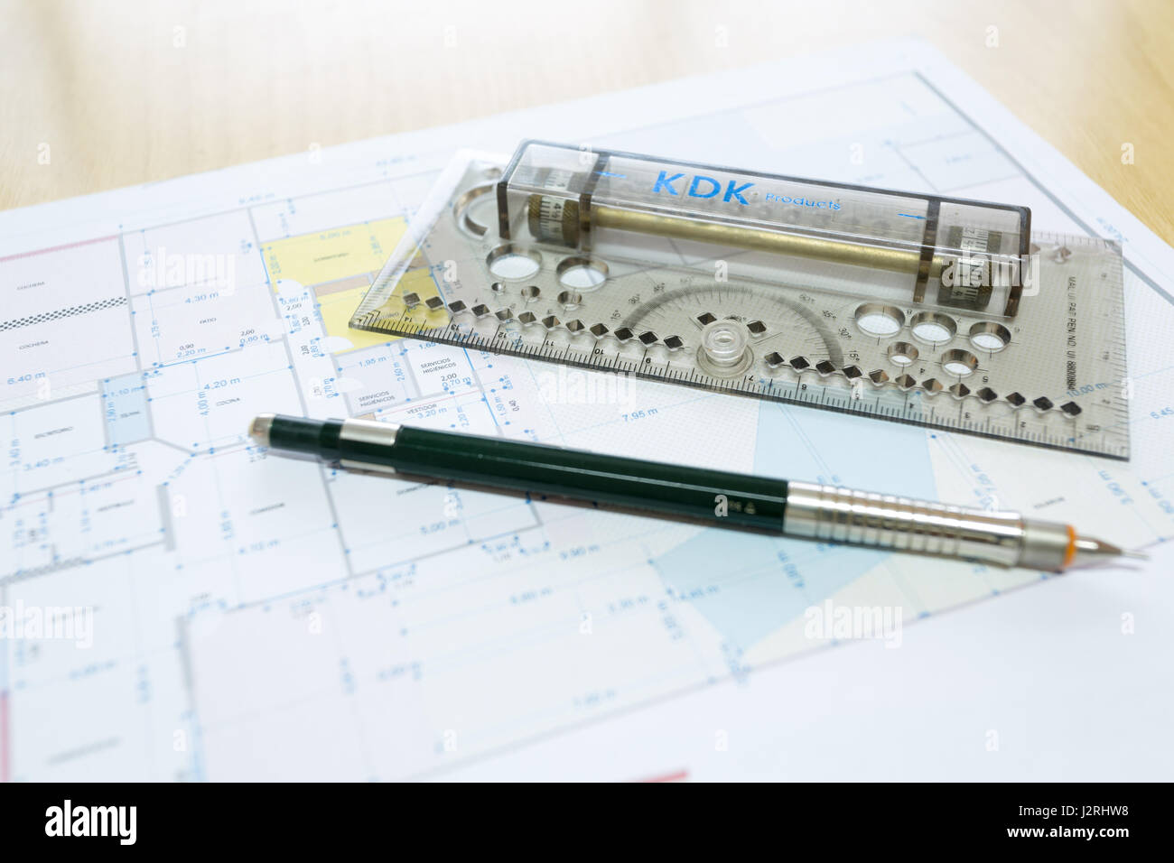 Multifunction wonder ruler and pencil lying on a floor planner Stock ...