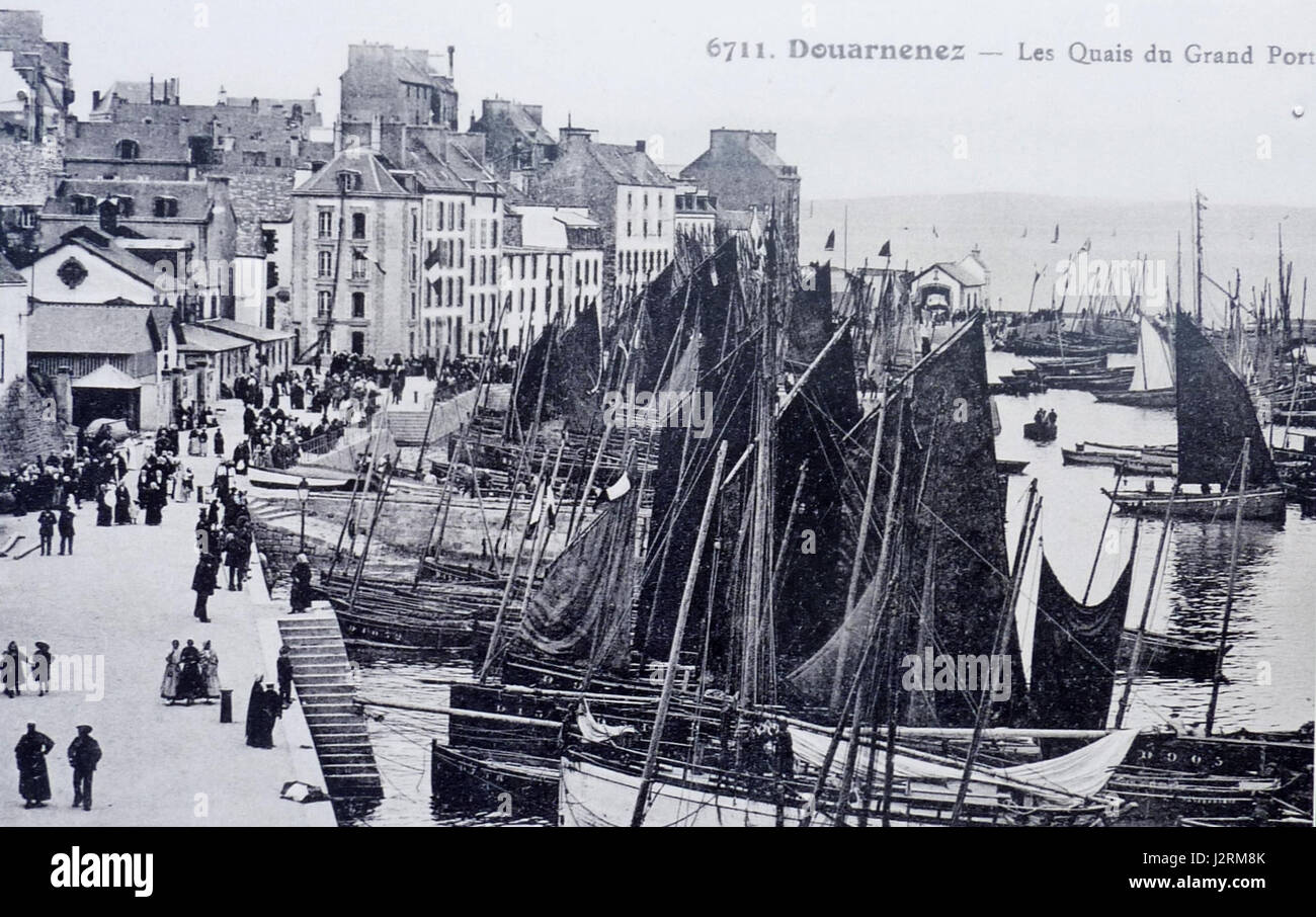 Douarnenez is a commune in Brittany, France, known for its harbor and fishing industry. It has historical significance, particularly for its maritime history and traditional boatbuilding. Stock Photo