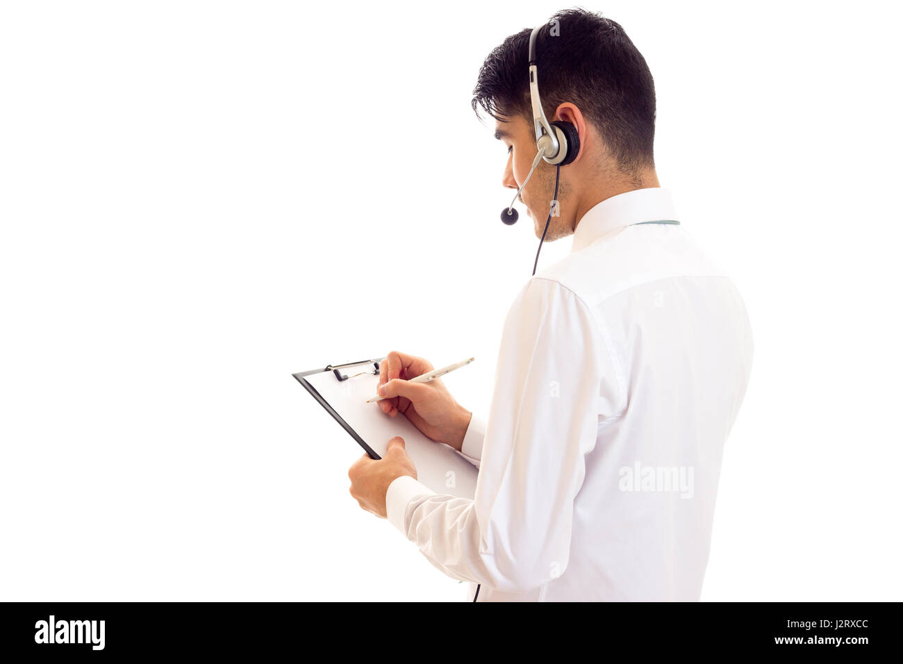 Young man in headphones holding a folder  Stock Photo