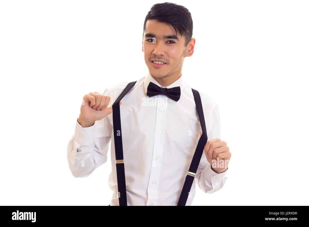 Young man with bow-tie and suspenders Stock Photo