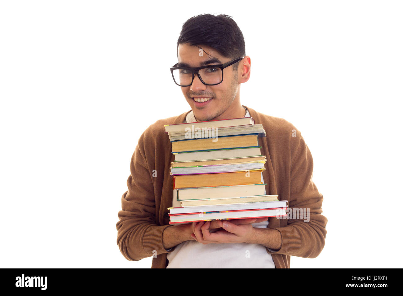 Young man in glasses with books Stock Photo