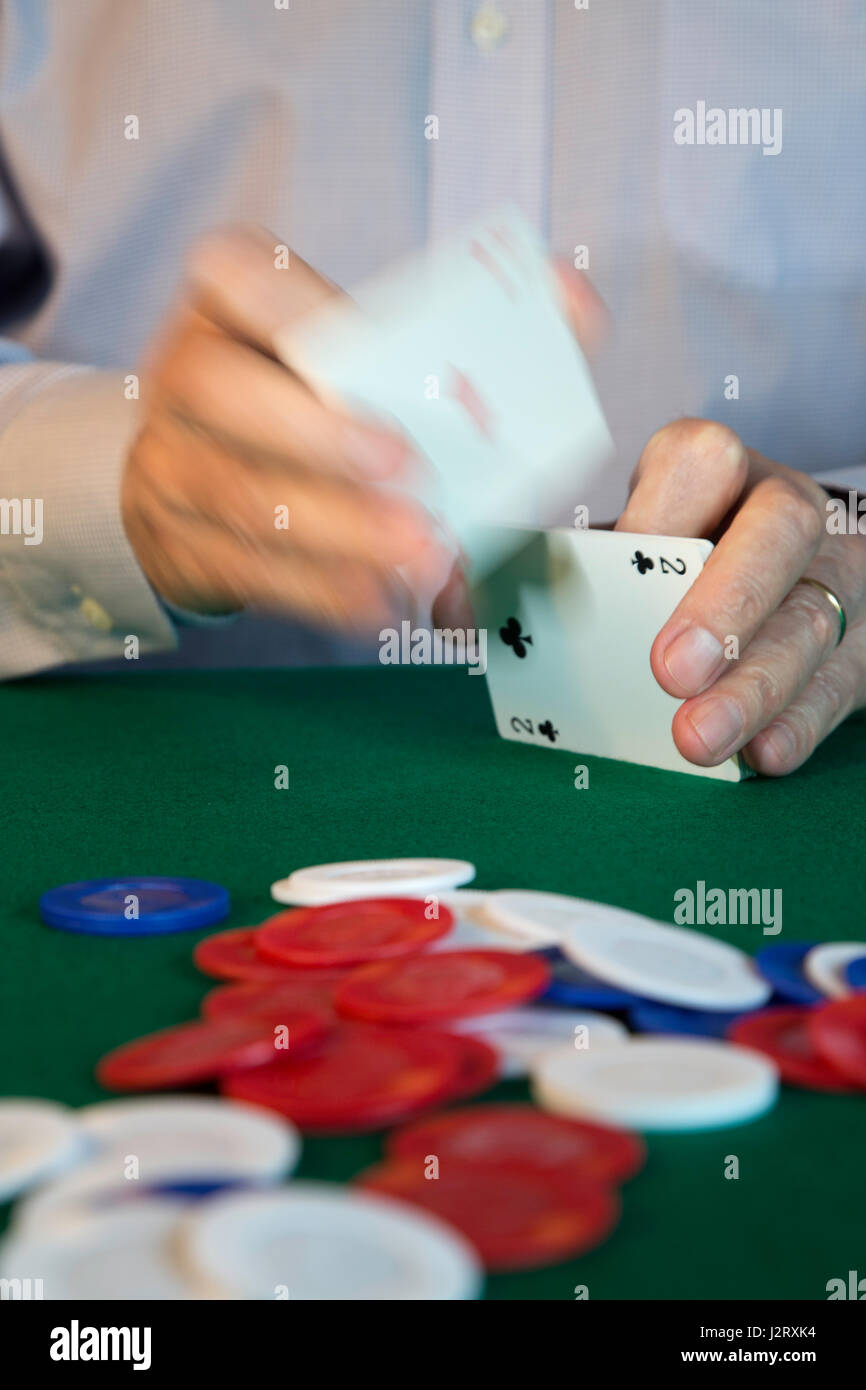 man Shuffling Cards Dealing at Poker Game Stock Photo