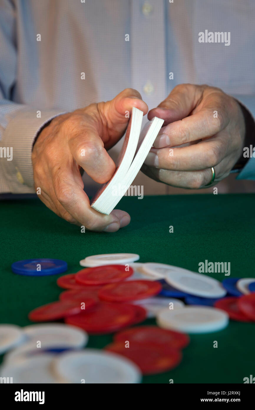 man Shuffling Cards Dealing at Poker Game Stock Photo