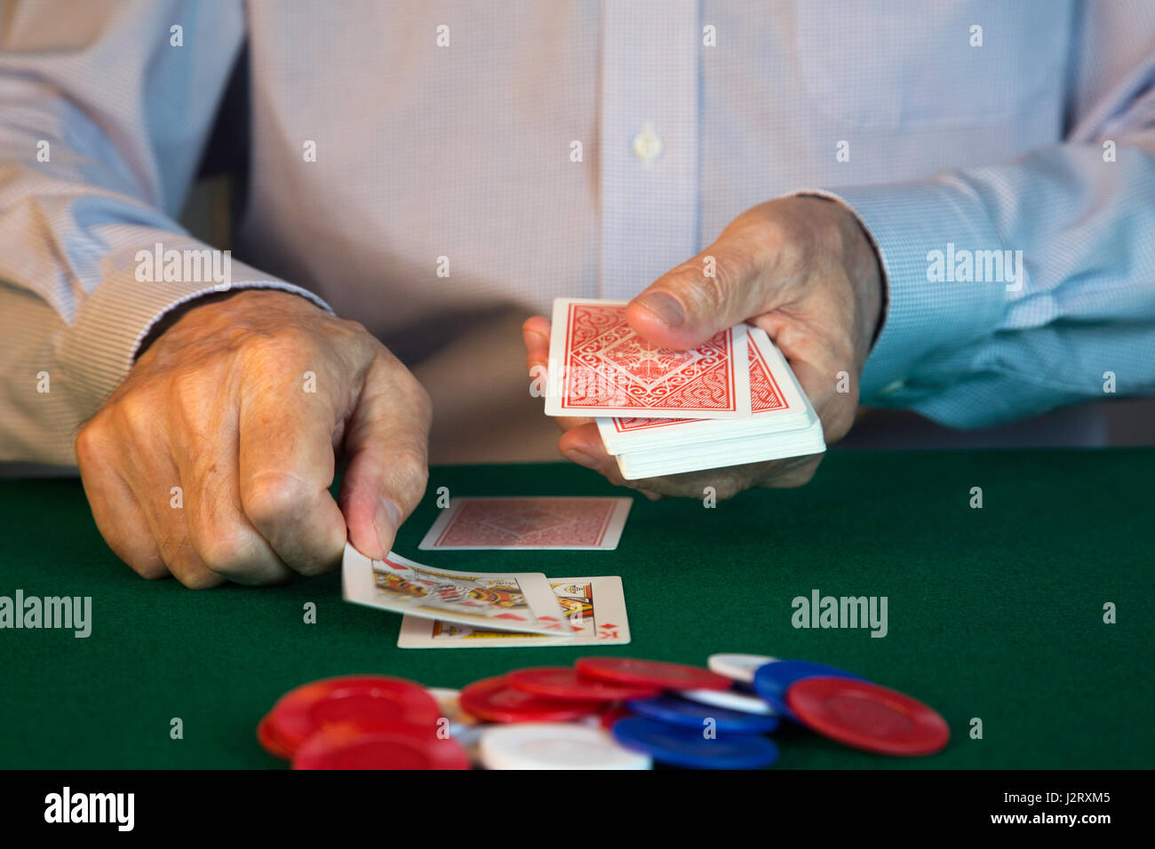 Man Dealing Cards for Poker Game Stock Photo