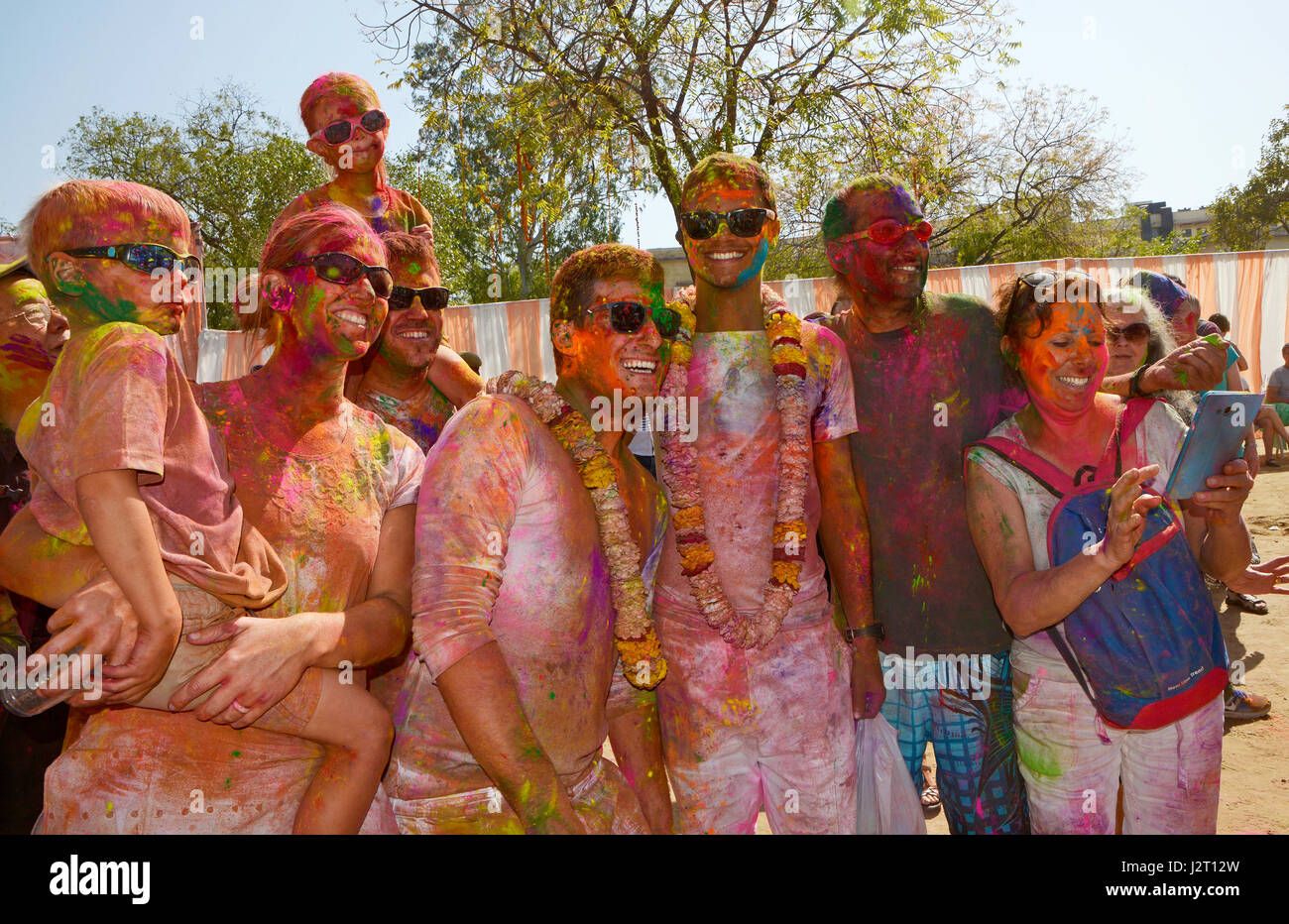 Foreign tourists playing holi in jaipur,India Stock Photo