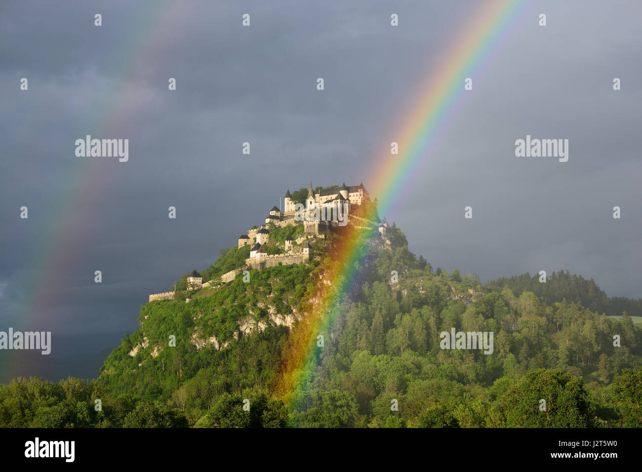 Double rainbow over the medieval hilltop castle of Hochosterwitz. Launsdorf, Carinthia, Austria. Stock Photo