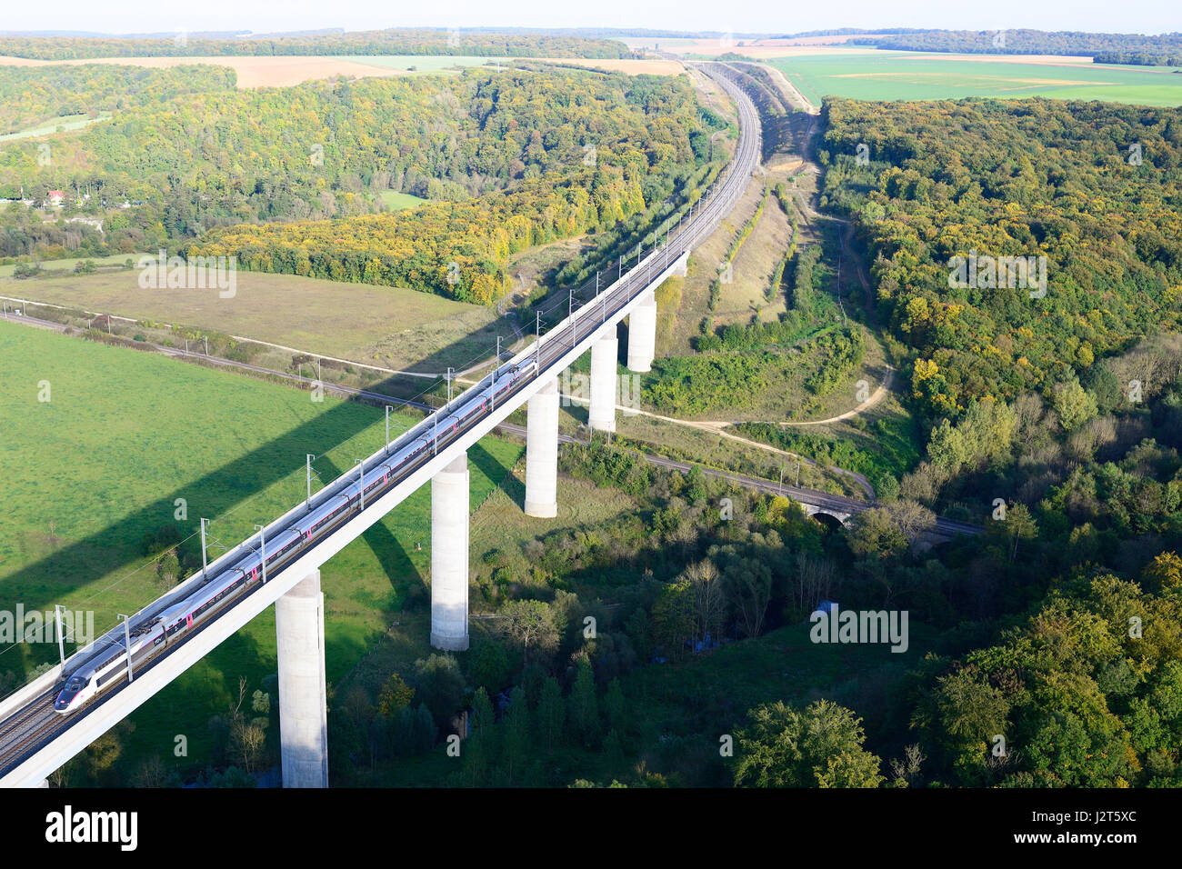 AERIAL VIEW. High-speed train on a viaduct. Viaduc de Jaulny, Thiaucourt-Regniéville, Meurthe-et-Moselle, Grand-Est, France. Stock Photo
