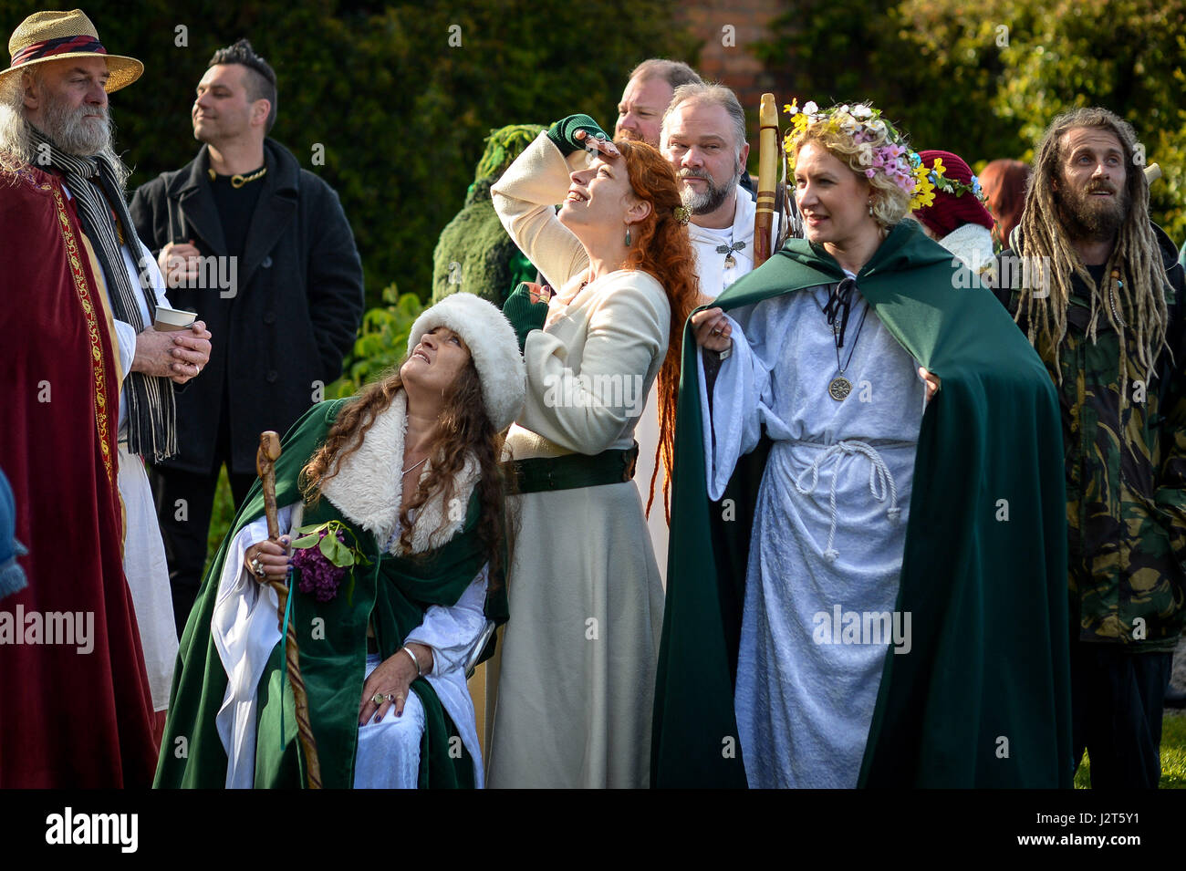 People at Chalice Well, Glastonbury, where Beltane festivities are taking place on May Day. Stock Photo
