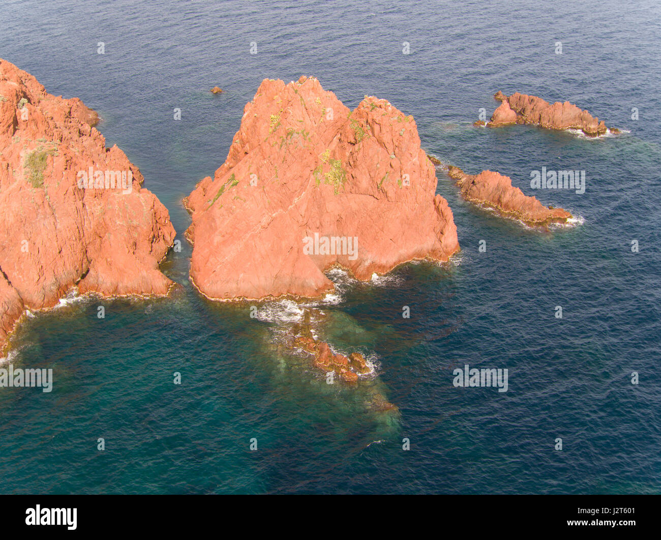 AERIAL VIEW. Sea stack off the coast of the Esterel Massif. Cap du Dramont, Saint-Raphaël, Var, French Riviera, France. Stock Photo