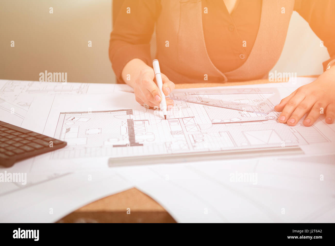 Details shot of architect blueprints on a desk Stock Photo