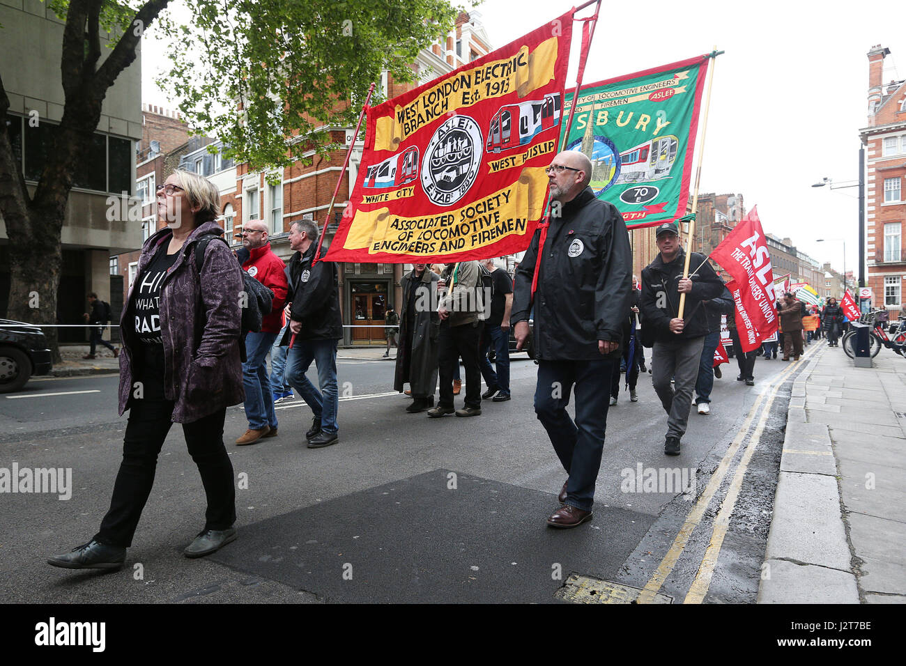 People take part in a May Day march on Theobalds Road in London. Stock Photo