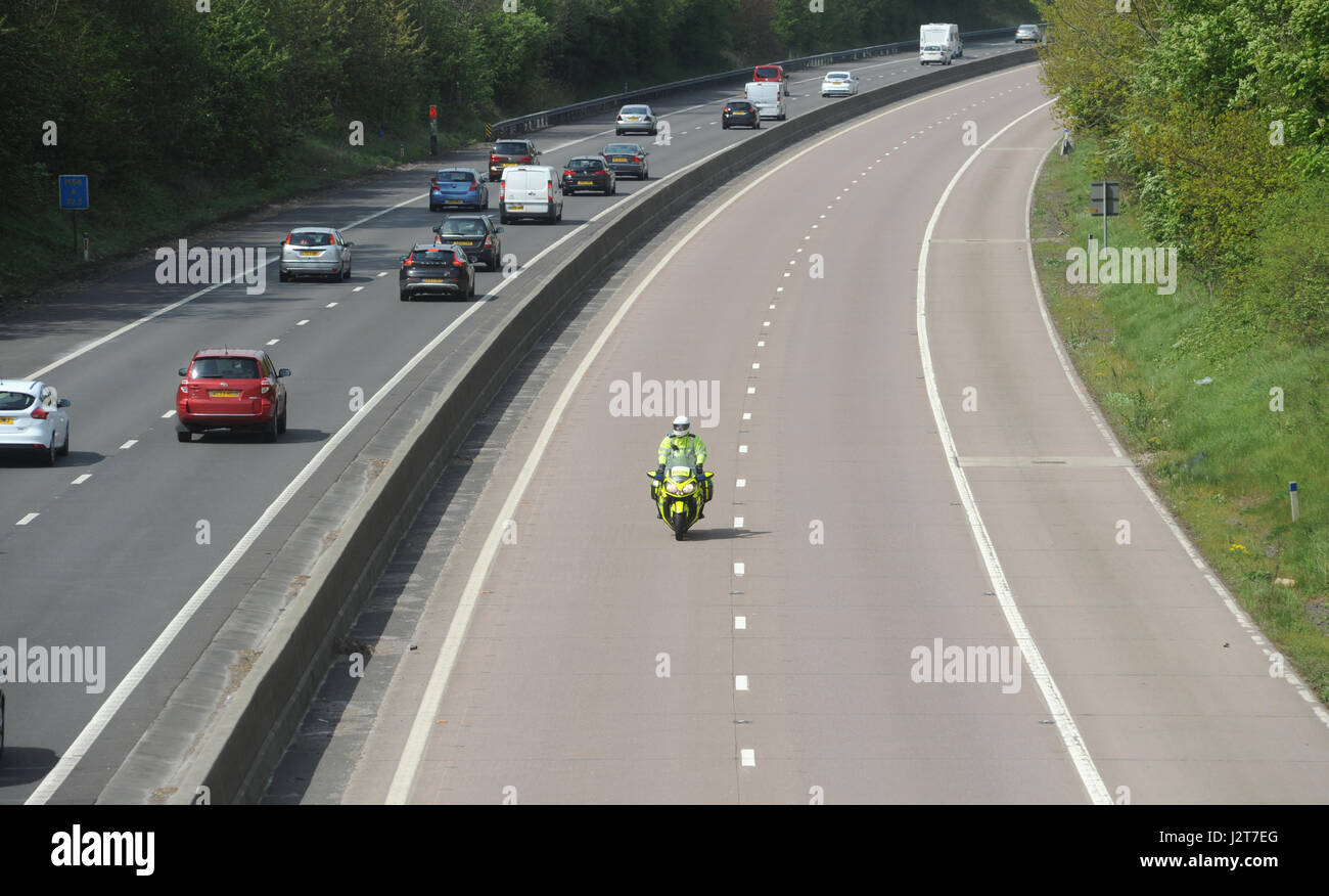 POLICE MOTORCYCLIST RIDER PATROLLING ON THE M54 MOTORWAY IN SHROPSHIRE Stock Photo