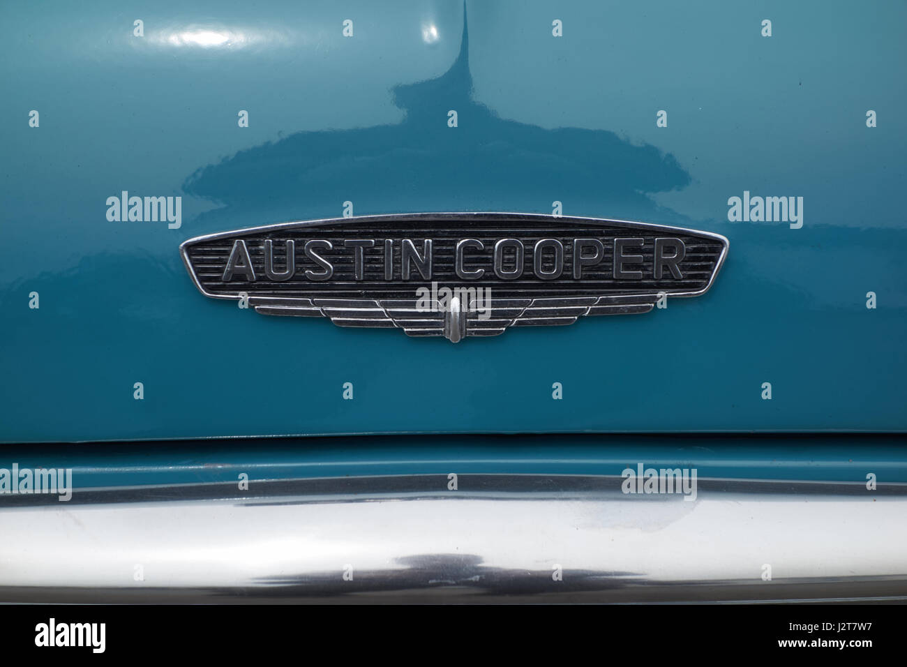 Austin Cooper emblem on bonnet of vintage blue mini. Stock Photo