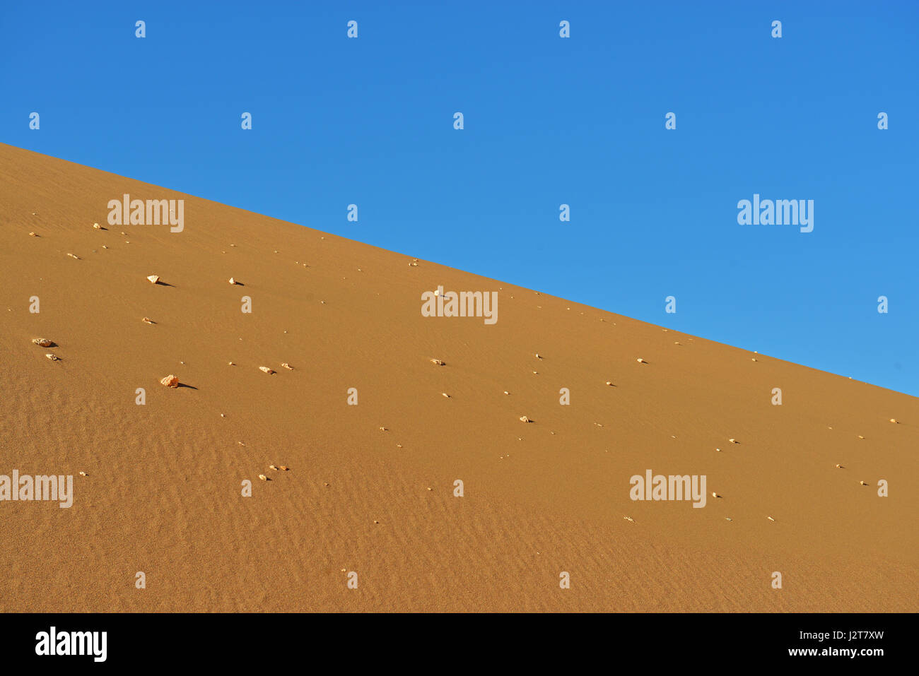Desert horizon with rocks in the sand dunes of the Atacama, Chile. Stock Photo