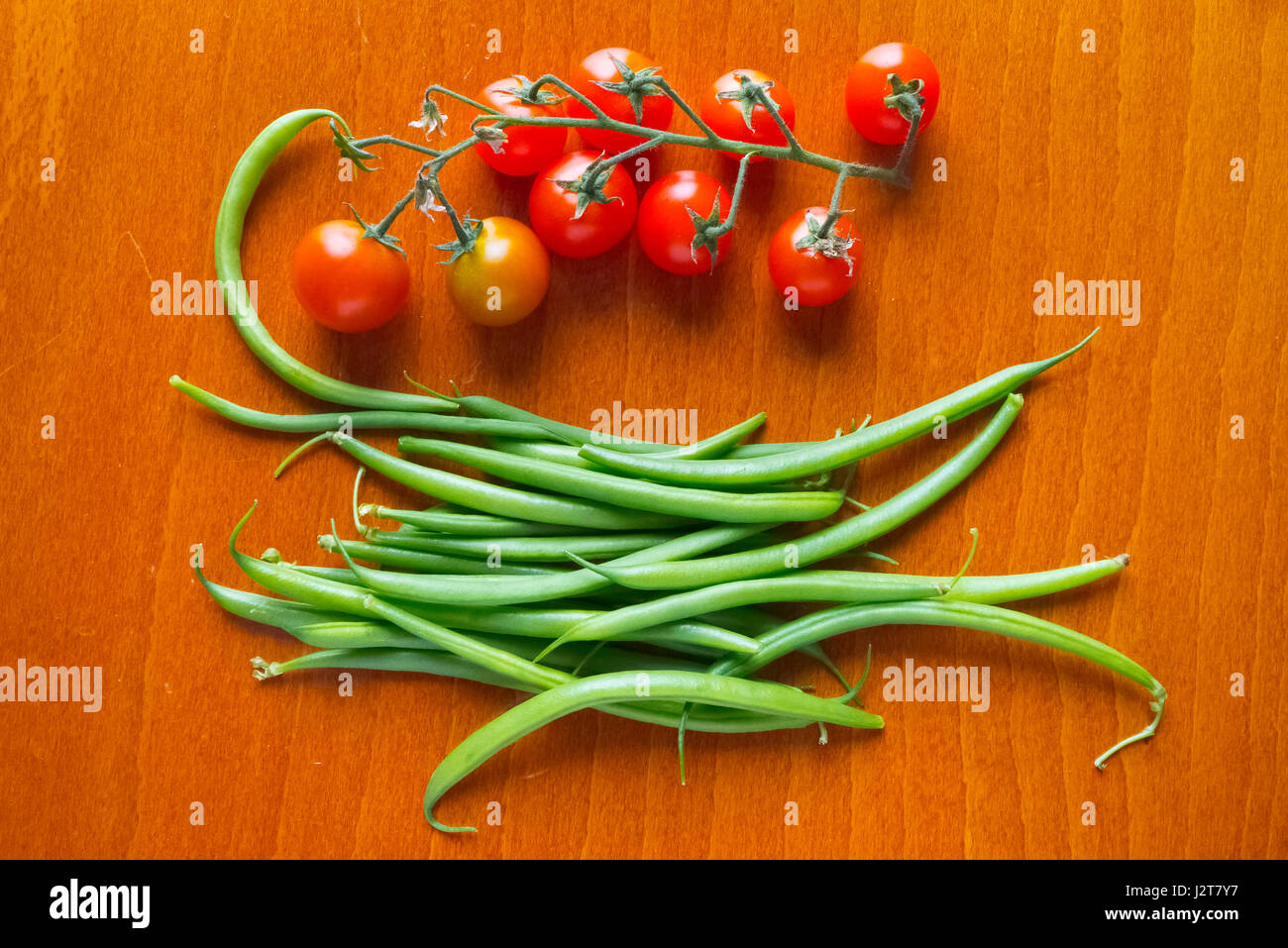 Cherry tomato and green beans Stock Photo Alamy