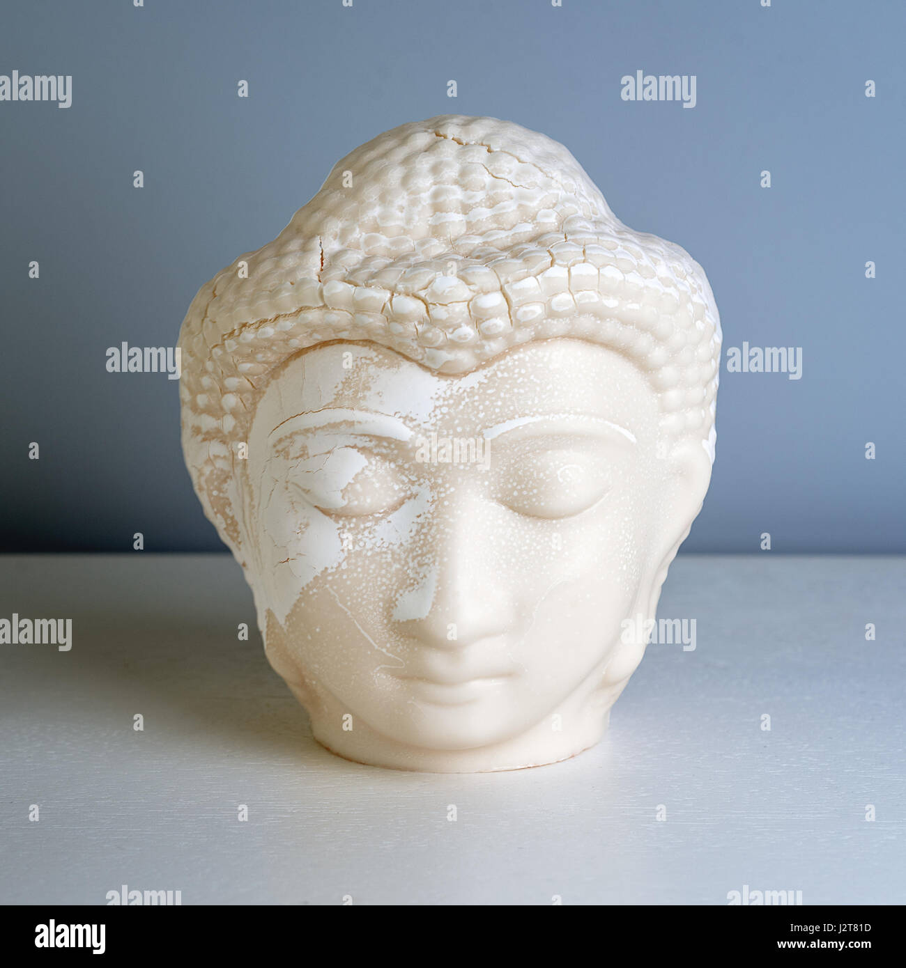 Buddha face. Buddha statue made of white marble. Concept of peace, calm