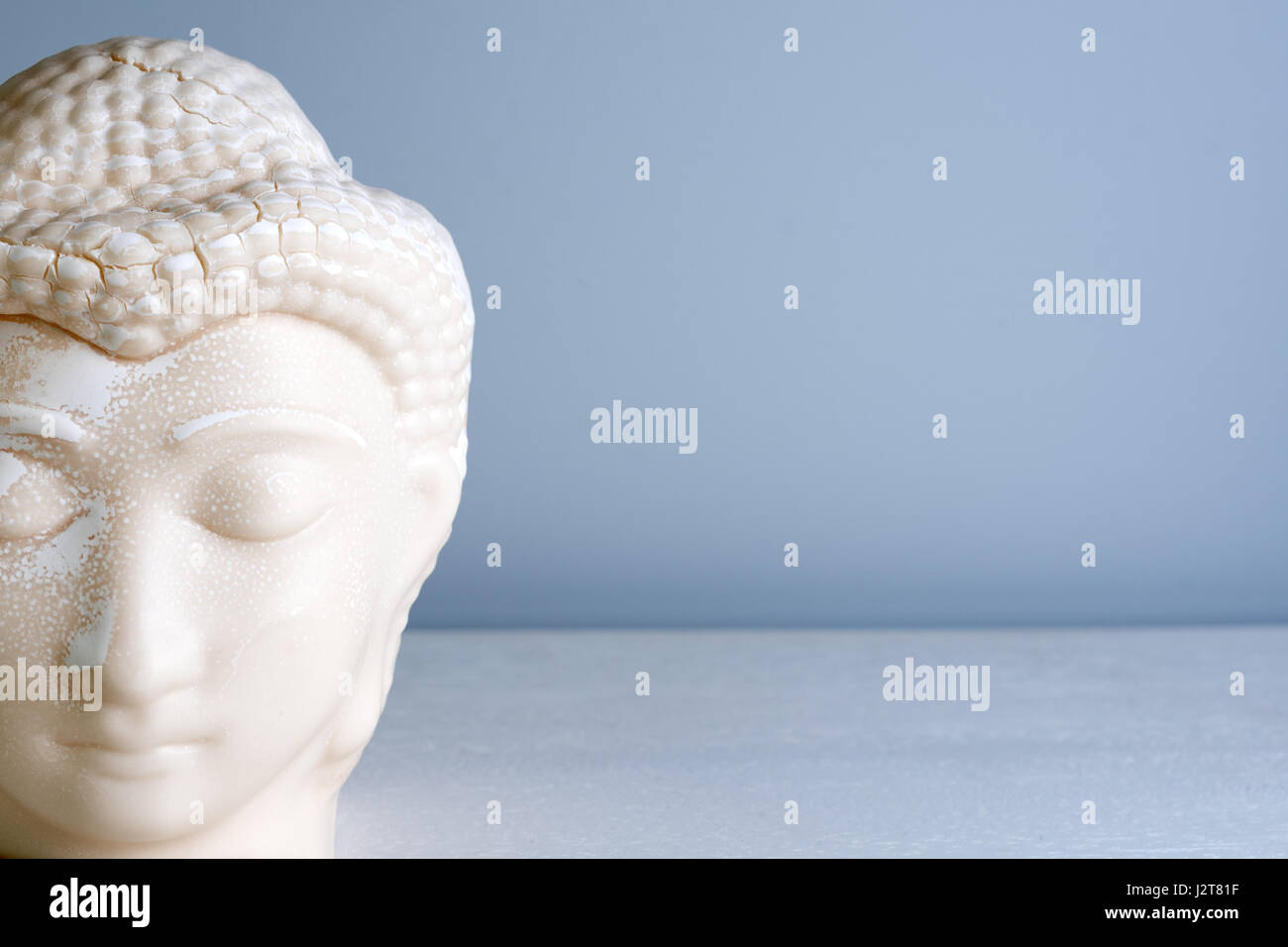 Buddha face. Buddha statue made of white marble with free space for