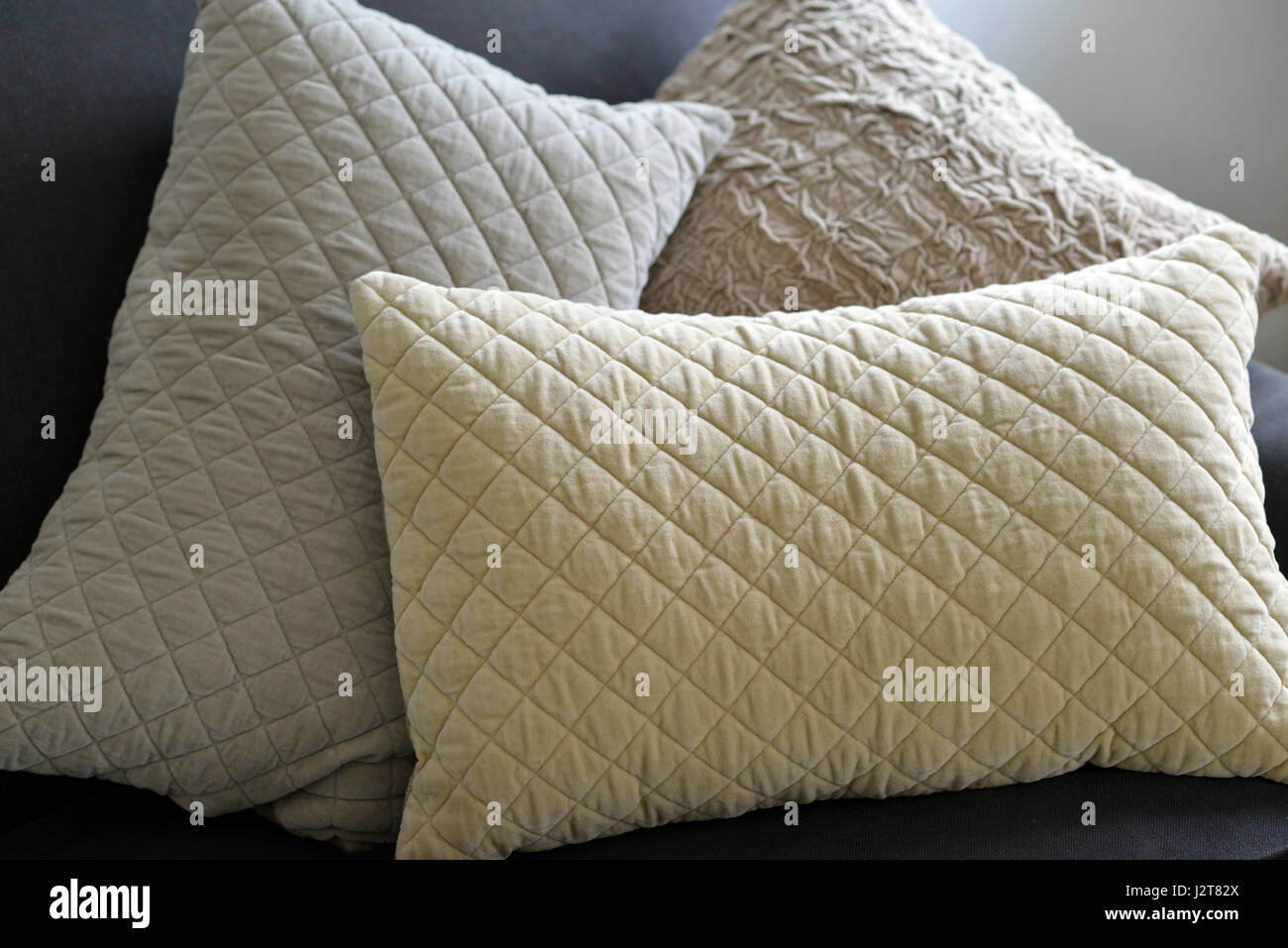 Textured cushions on a couch Stock Photo - Alamy