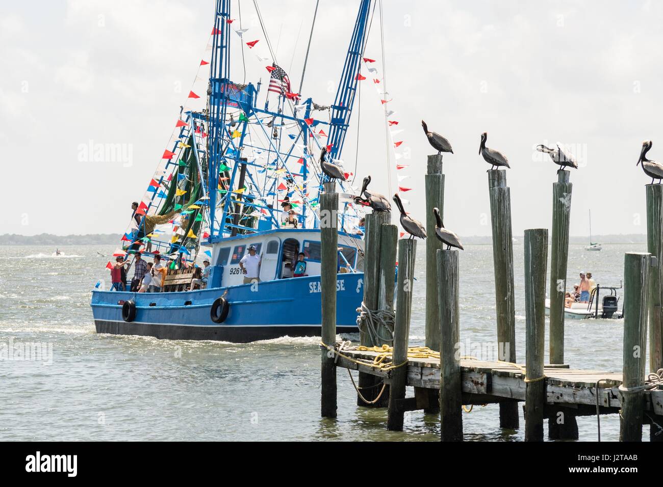 Charleston, USA. 30th Apr, 2017. A decorated shrimp boat parades past the commercial fishing docks down Shem Creek during the annual Blessing of the Fleet signifying the start of the commercial shrimping season April 30, 2017 in Mount Pleasant, South Carolina. Coastal shrimping is part of the low country heritage but has been declining rapidly with rising costs and increased foreign competition. Credit: Planetpix/Alamy Live News Stock Photo