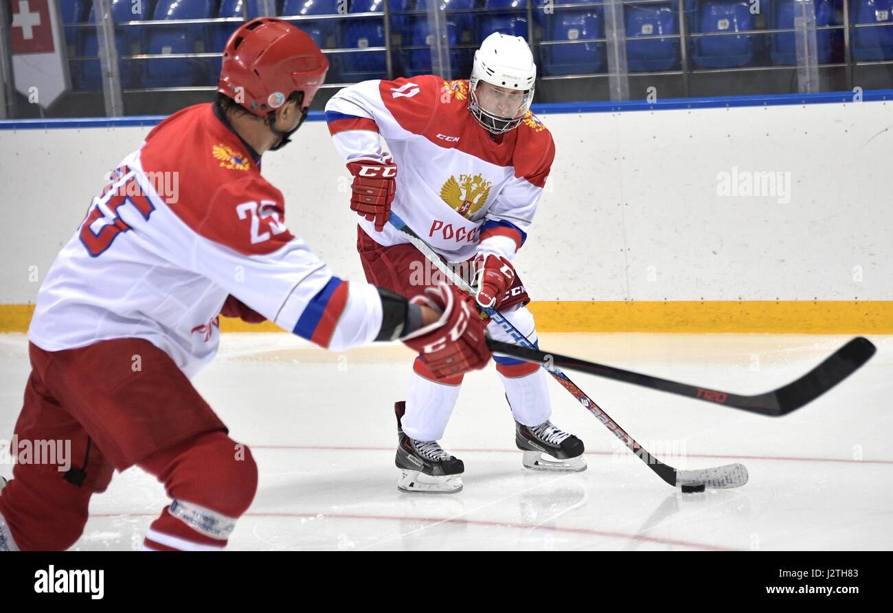Russian President Vladimir Putin plays ice hockey during a training session Olympic Shaiba Arenain April 30, 2017 in Sochi, Russia. Stock Photo