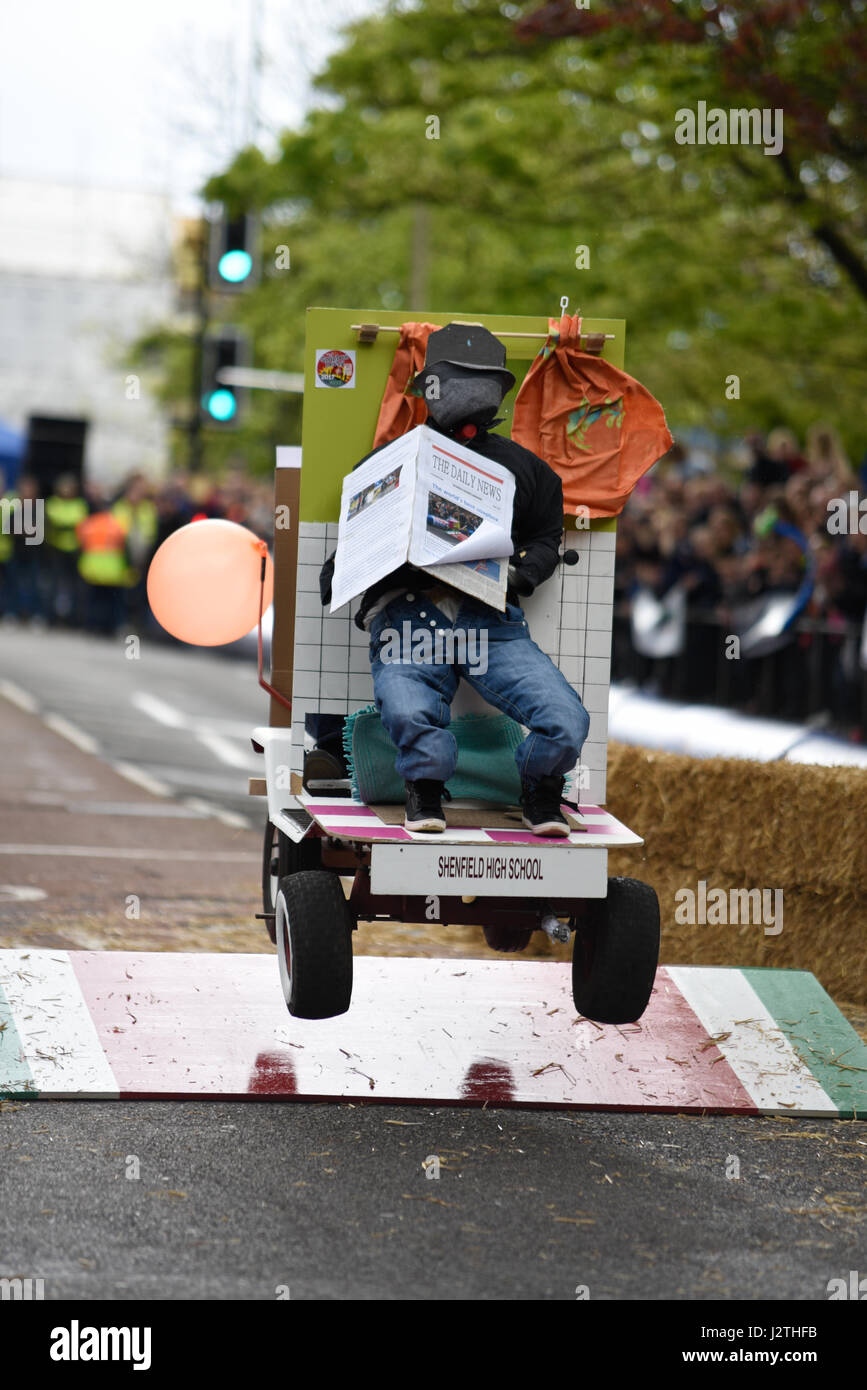 Soapbox, or soap box, derby carts leap over the jump ramps during an event in Billericay, Essex, UK. Home made race vehicles Stock Photo