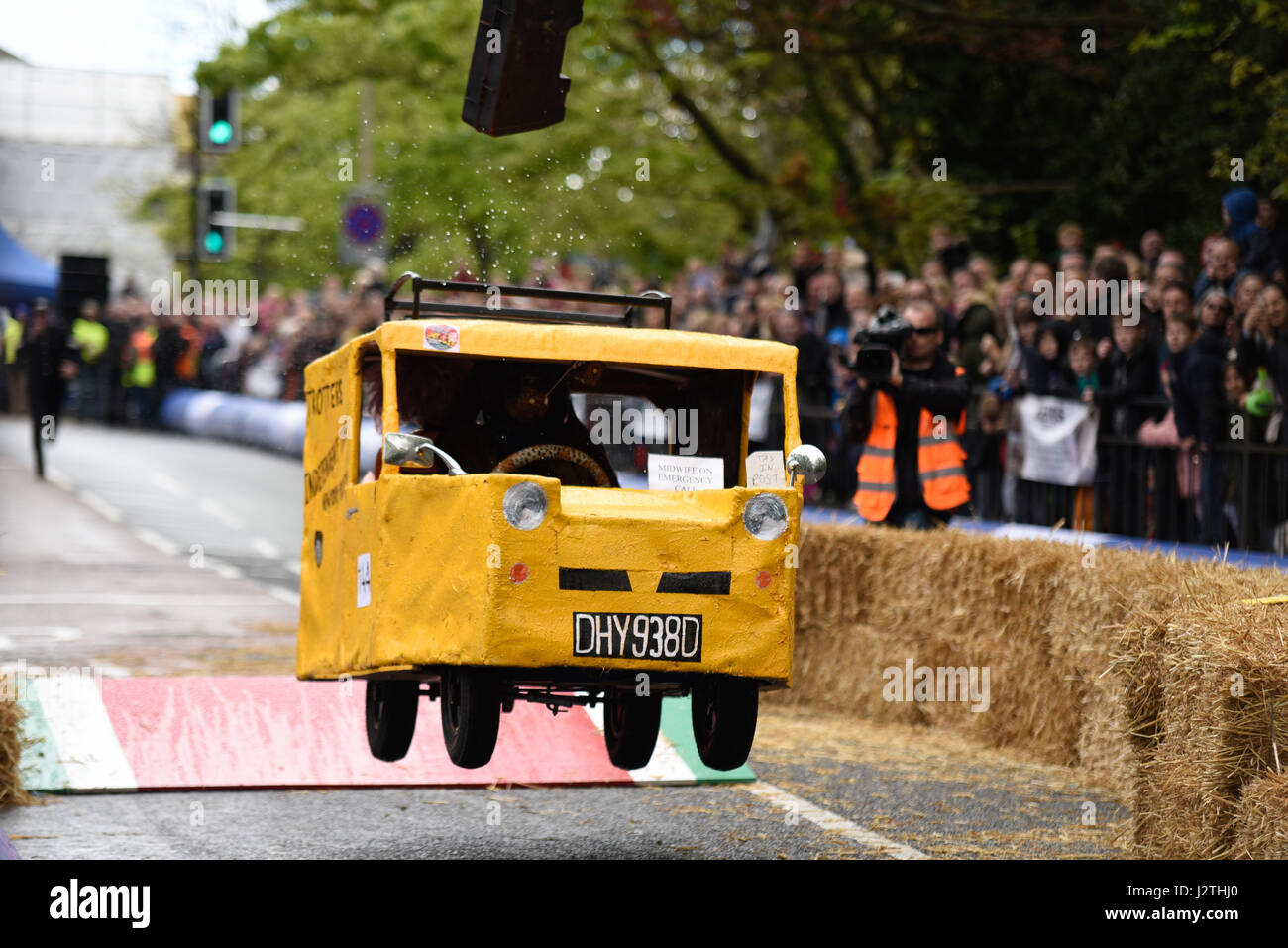 Soapbox, or soap box, derby carts leap over the jump ramps during an