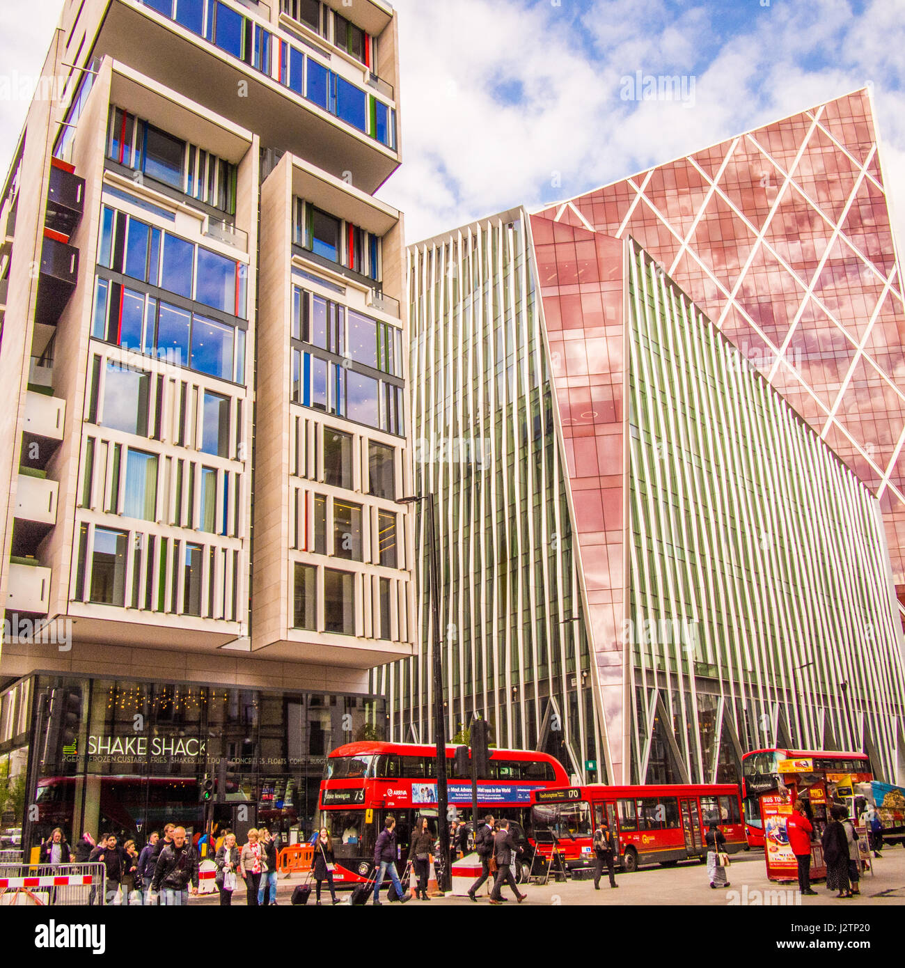Modern architecture in London along with the traditional red buses Stock Photo