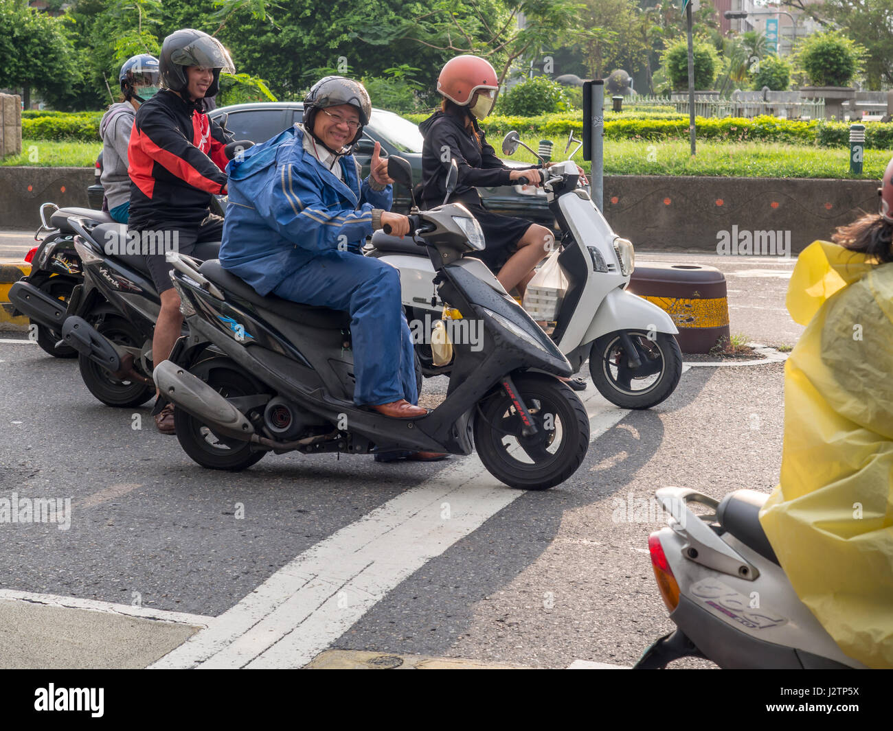 Tainan, Taiwan - October 11, 2016: The people of Taiwan on scooters Stock Photo