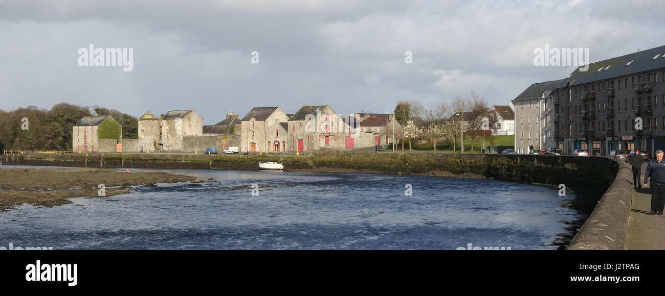 The River Lennon in Ramelton, County Donegal, Ireland, with old warehouse stores in the background. Stock Photo