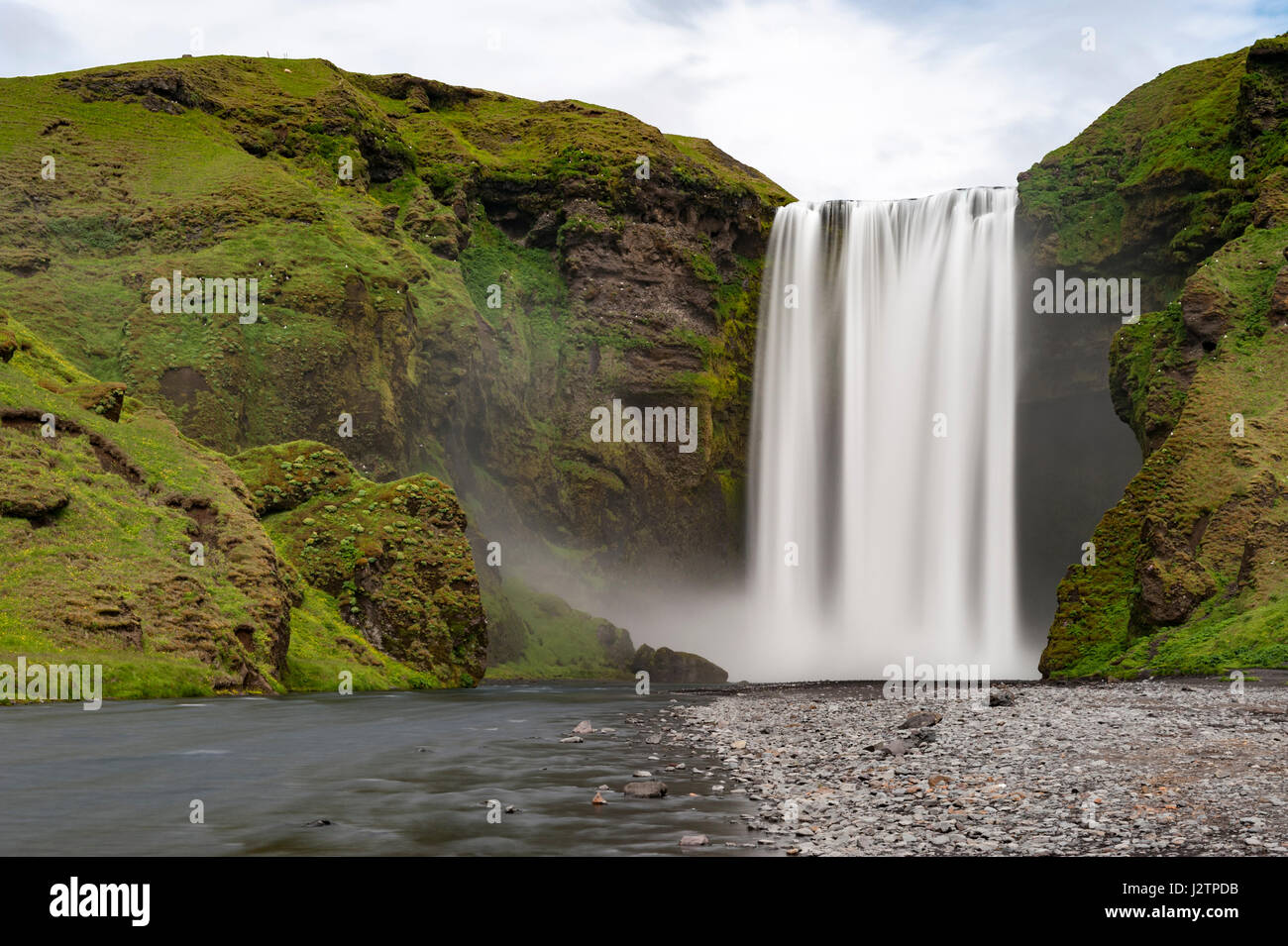 Long exposure of Skogafoss waterfall, Skoga river, mist, nobody, waterfalls of Iceland. Stock Photo