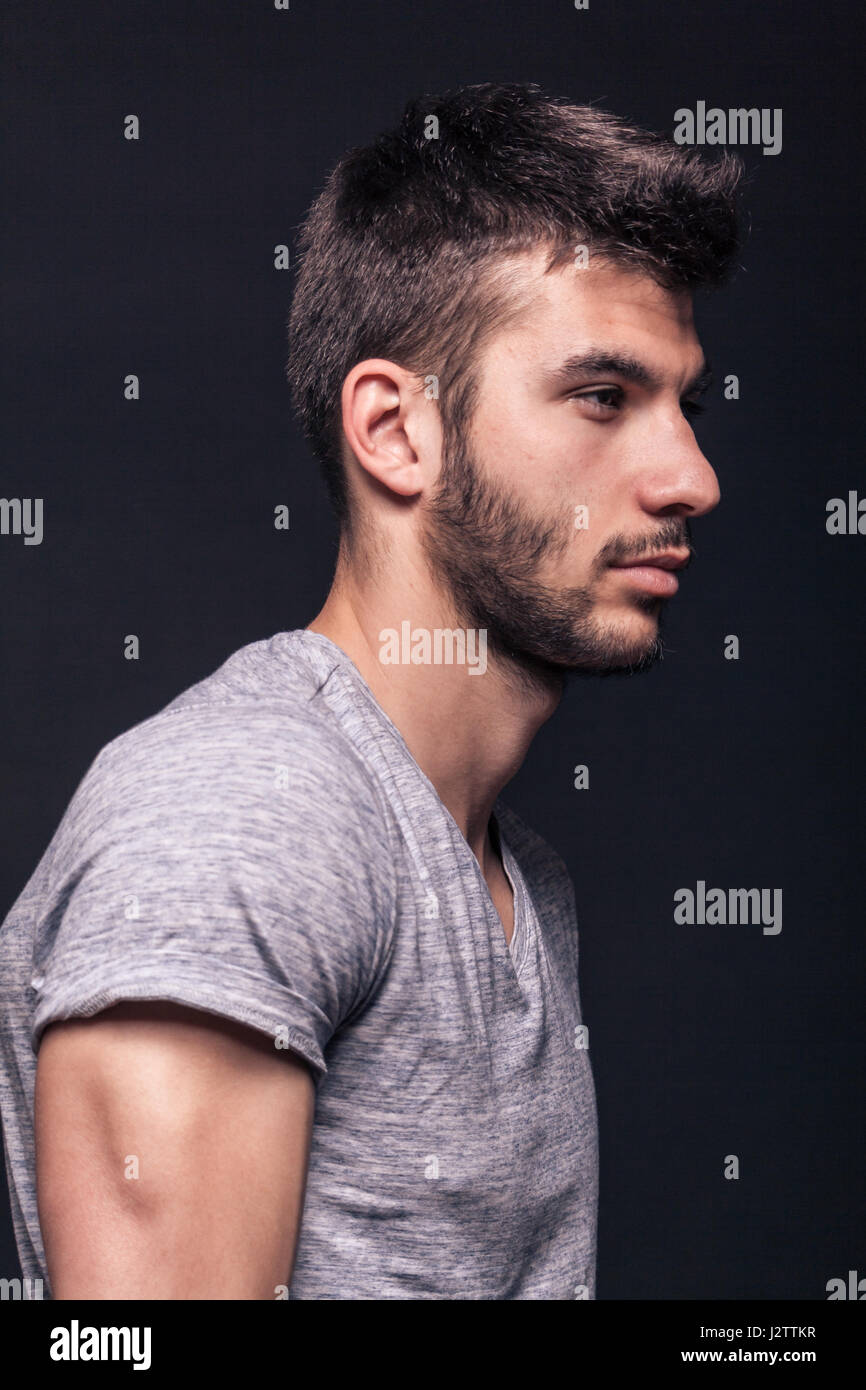 Young african american man over isolated background looking to side, relax  profile pose with natural face with confident smile. Stock Photo | Adobe  Stock