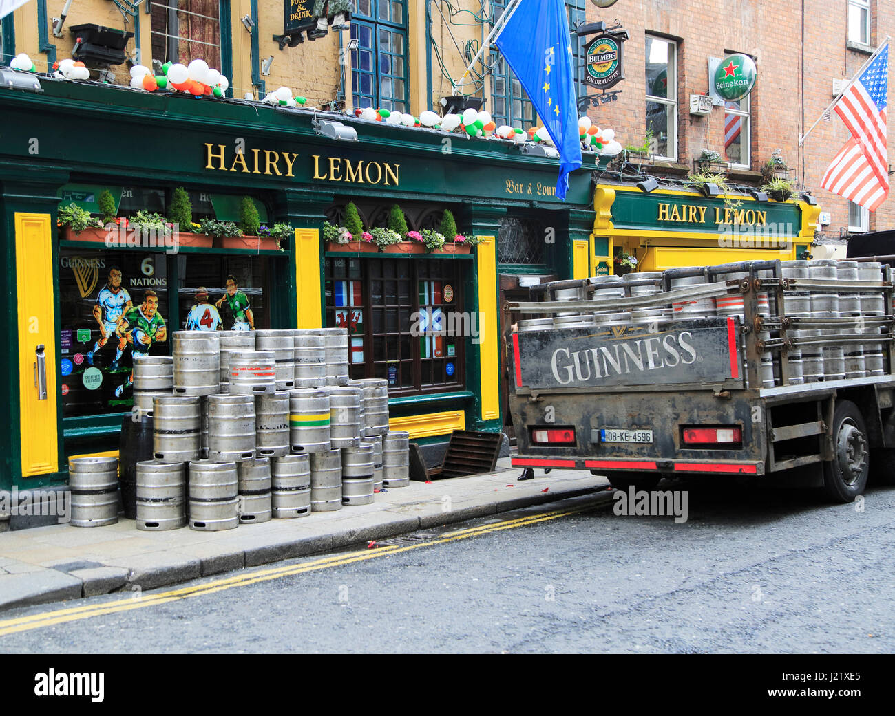 Delivery of Guinness beer barrels to traditional Hairy Lemon pub, city
