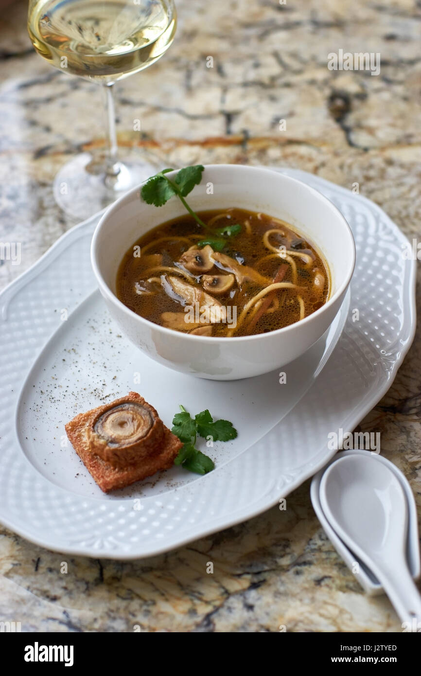 Mushroom soup with egg noodles Stock Photo Alamy