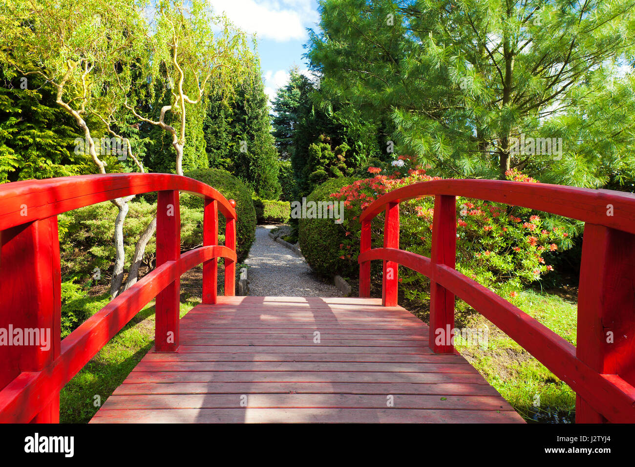 Red bridge in a beautiful Japanese Garden Stock Photo Alamy