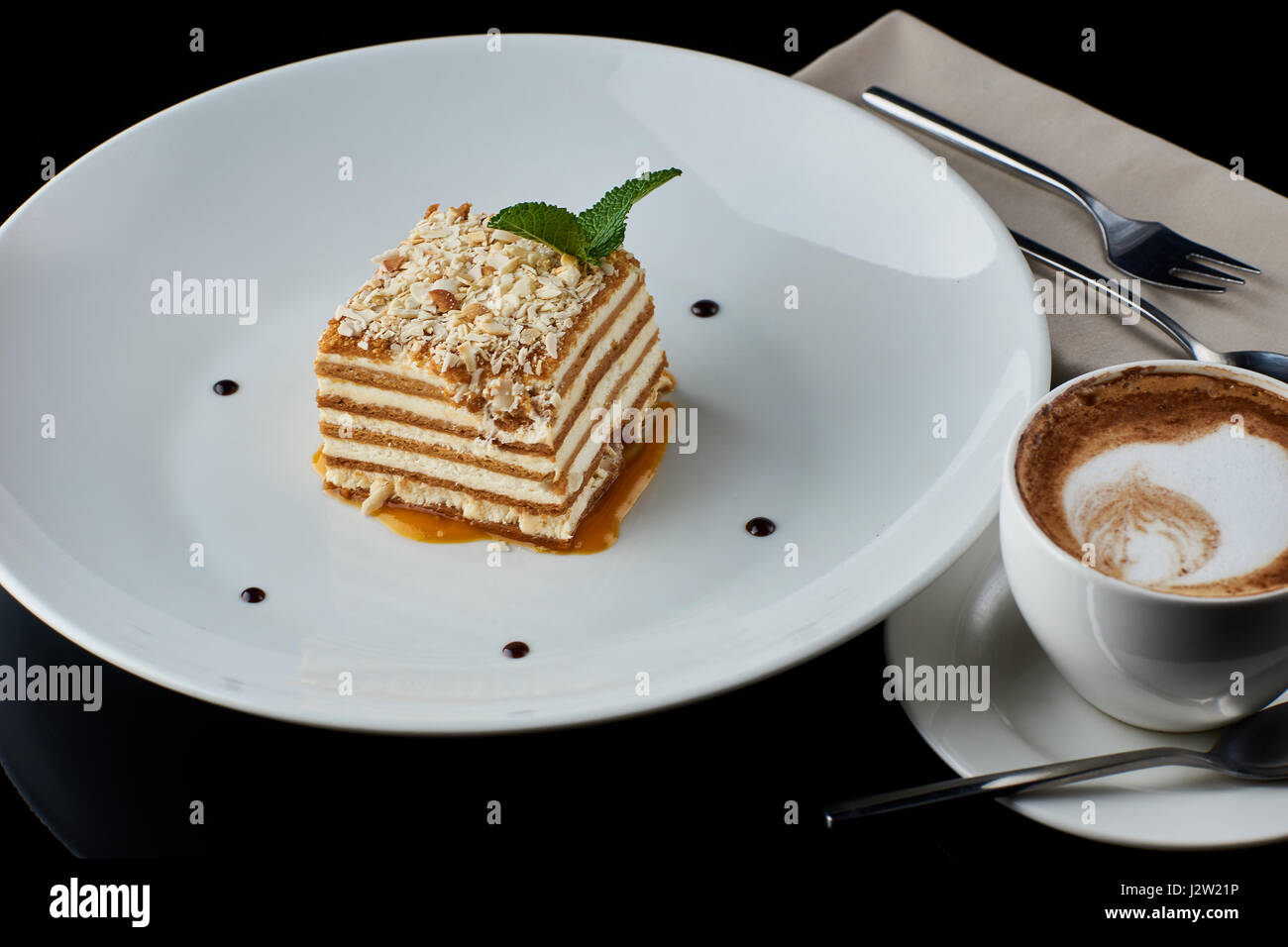 Slice of layered honey cake Stock Photo