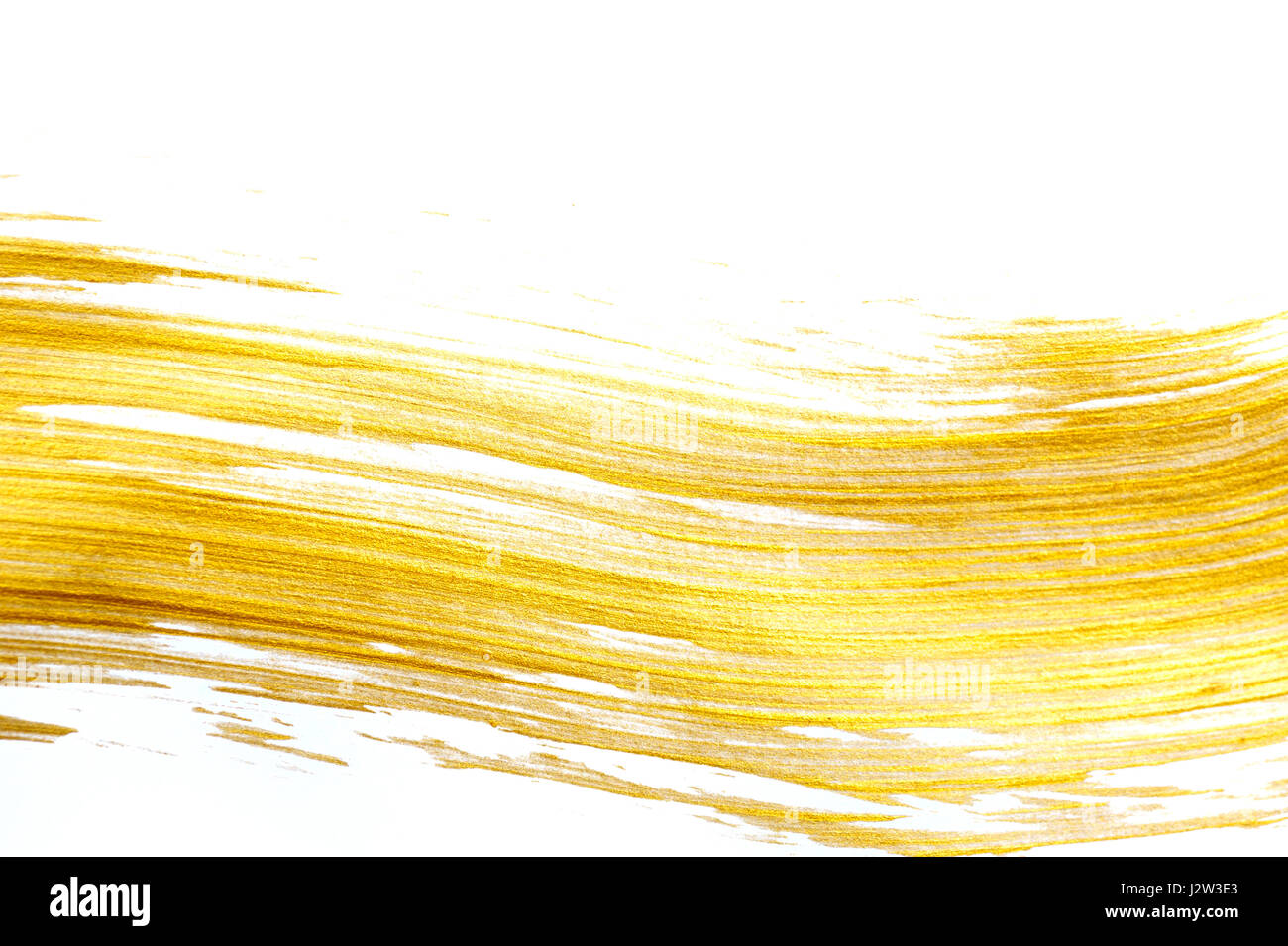 Abstract gold background with acrylic paint brush Stock Photo