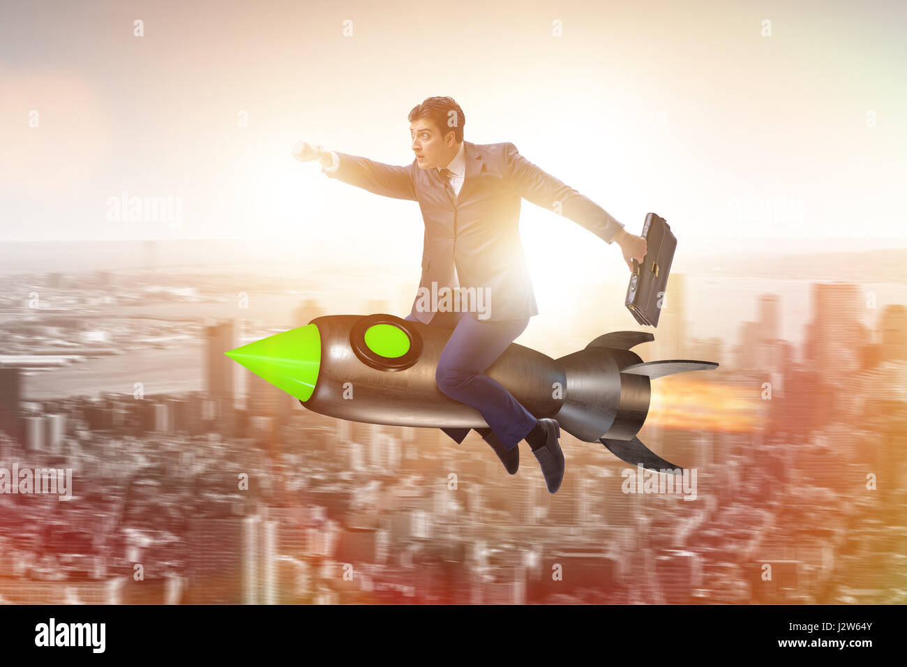 Male businessman flying on rocket in business concept Stock Photo - Alamy