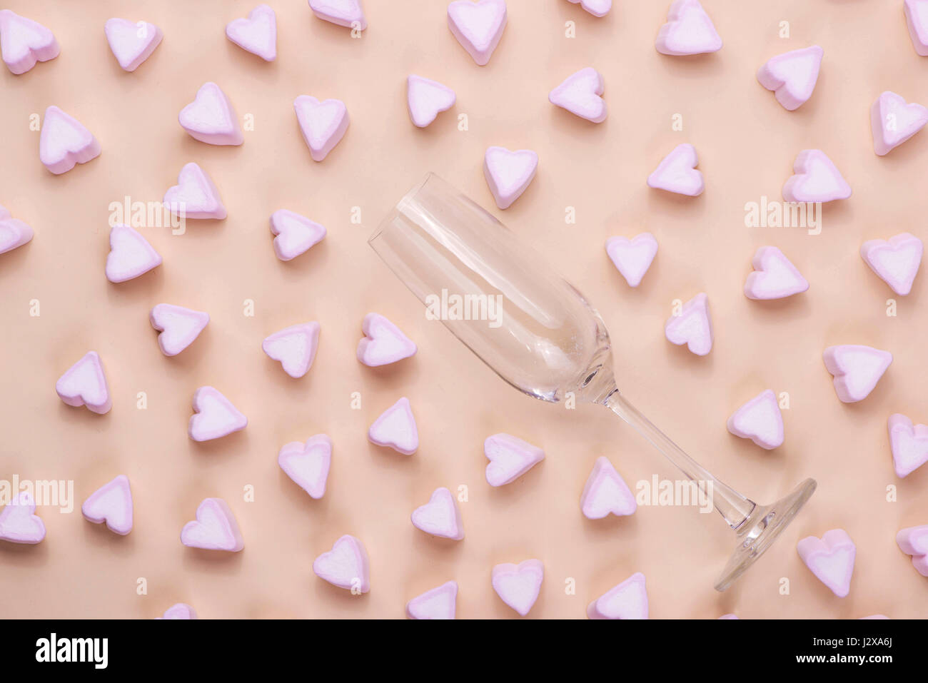 Valentines Day Glass with lots of candy hearts marshmallows Stock Photo