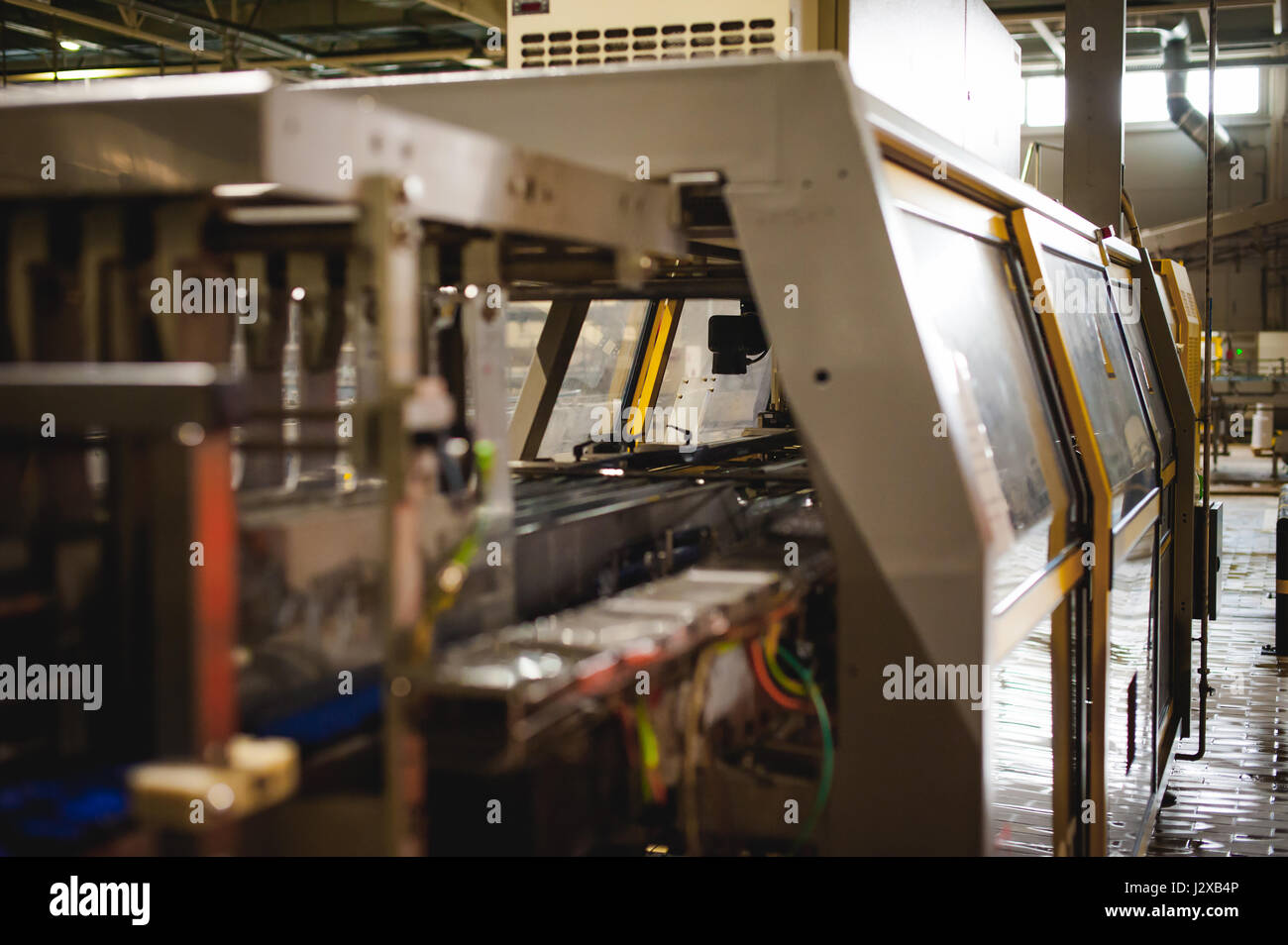 Beer production line. Equipment for the staged production and bottling of the finished product. Special industrial technological device at the factory Stock Photo