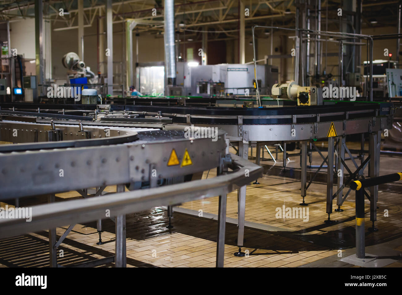 Beer production line. Equipment for the staged production and bottling of the finished product. Special industrial technological device at the factory Stock Photo