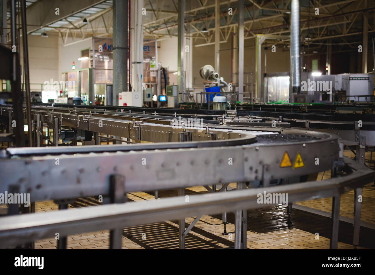 Beer production line. Equipment for the staged production and bottling of the finished product. Special industrial technological device at the factory Stock Photo