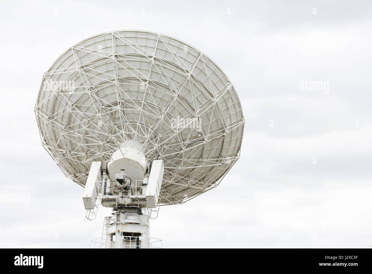 Radio telescope dish pointing at the sky Stock Photo