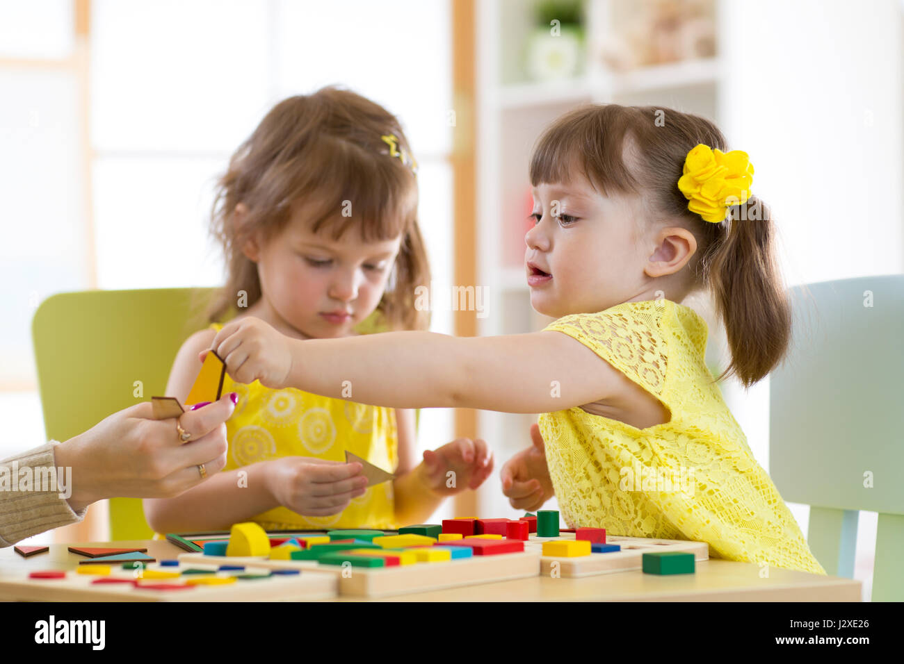 Primary school children playing toys hi-res stock photography and