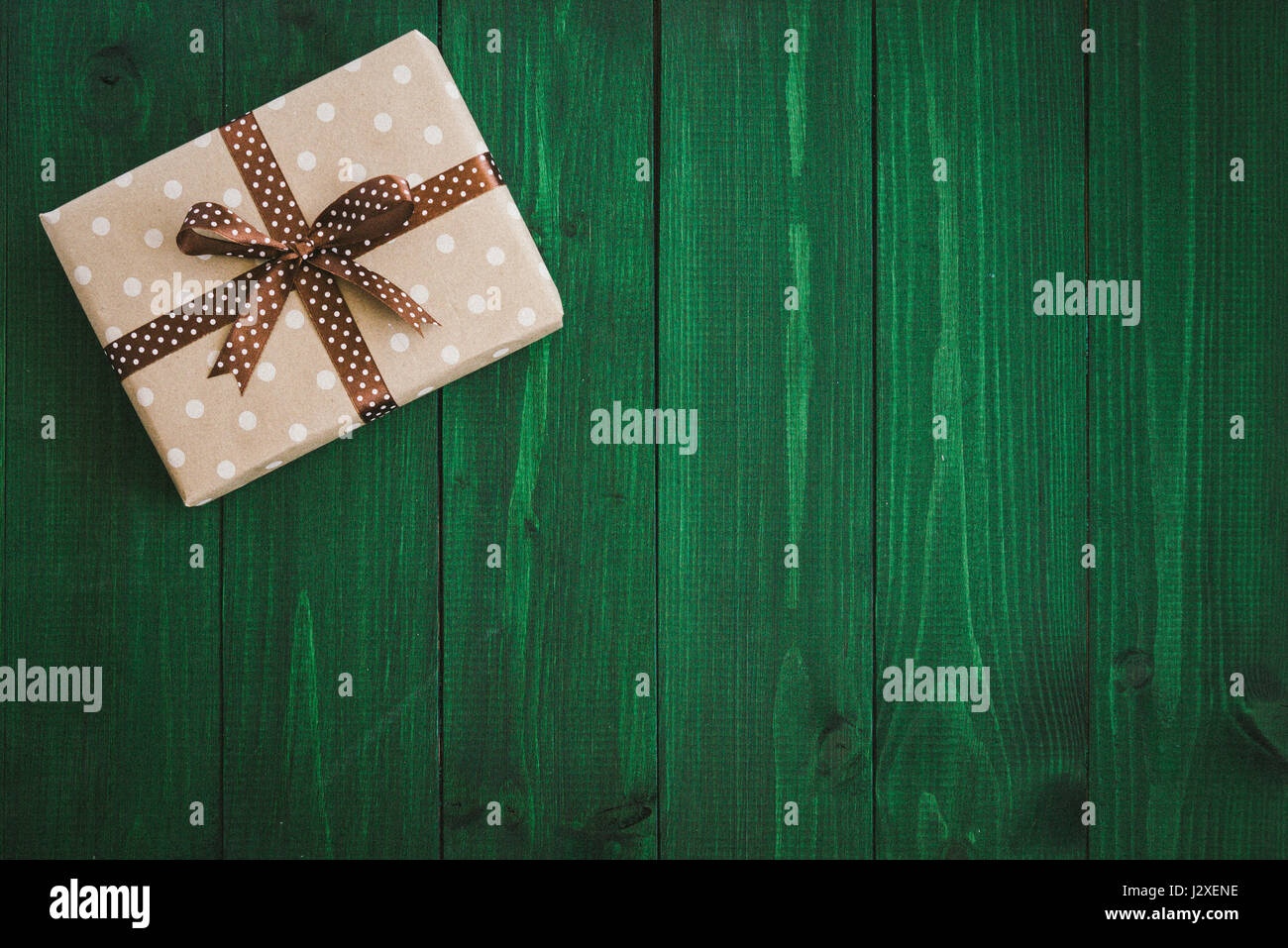 Gift box wrapped in craft paper with dried flowers Stock Photo - Alamy