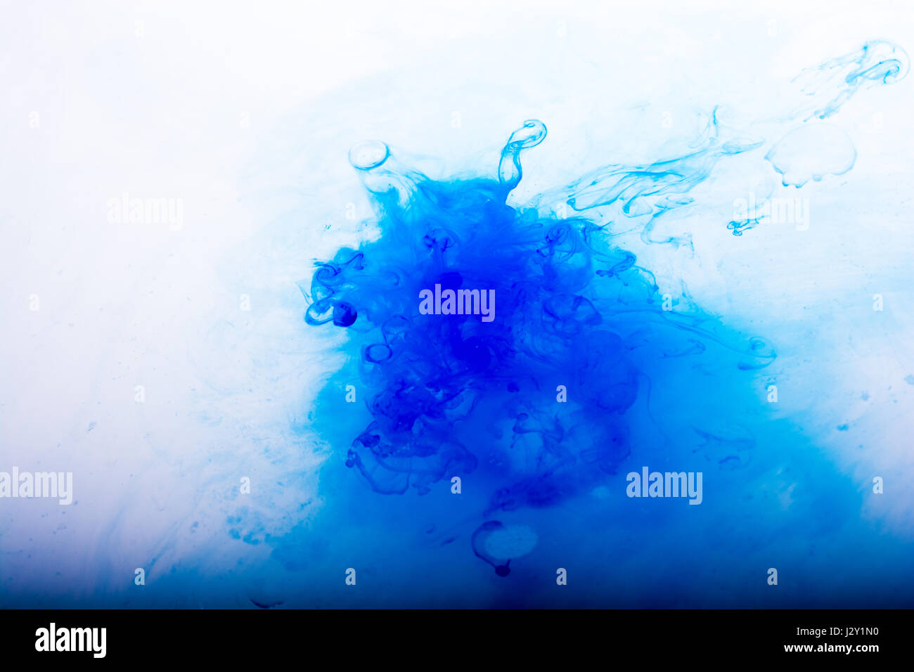 Watercolor paint dissolving in pure water Stock Photo - Alamy