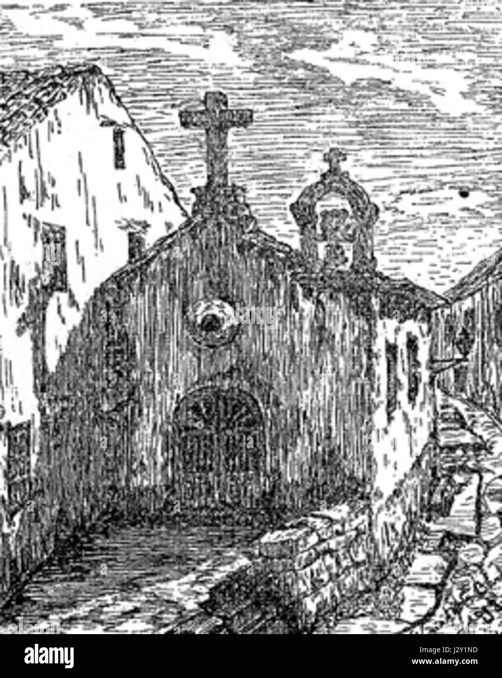 The Capela Madre Deus Antiga is an old chapel, likely located in a historic region. Its name translates to 'Old Mother of God Chapel,' reflecting its religious significance. Stock Photo