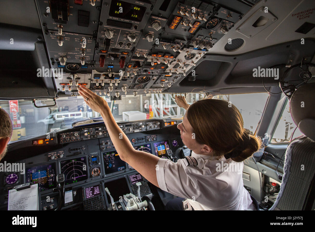 cockpit of modern jetliner with female co-pilot Stock Photo
